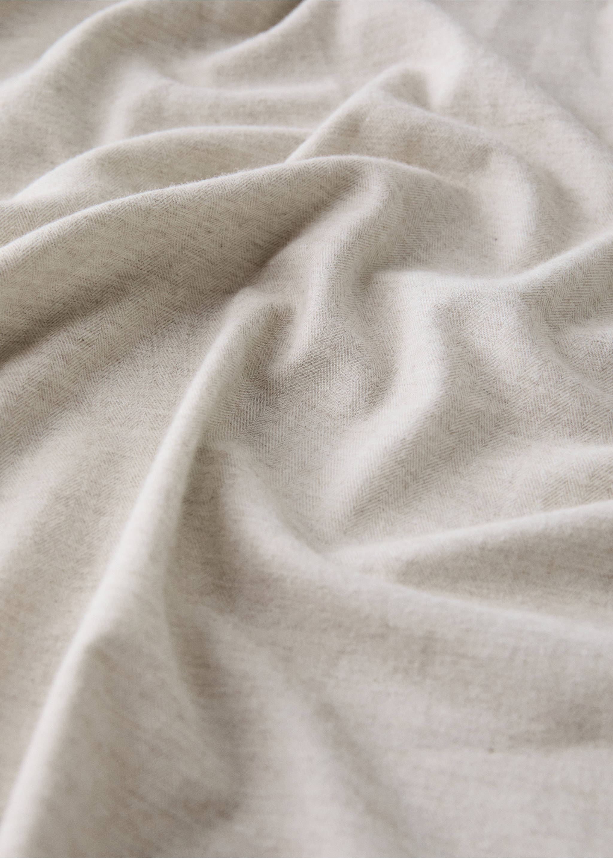 Close-up of a neutral beige fitted sheet with a fine herringbone pattern., Sand. Ref: 37048268-00.