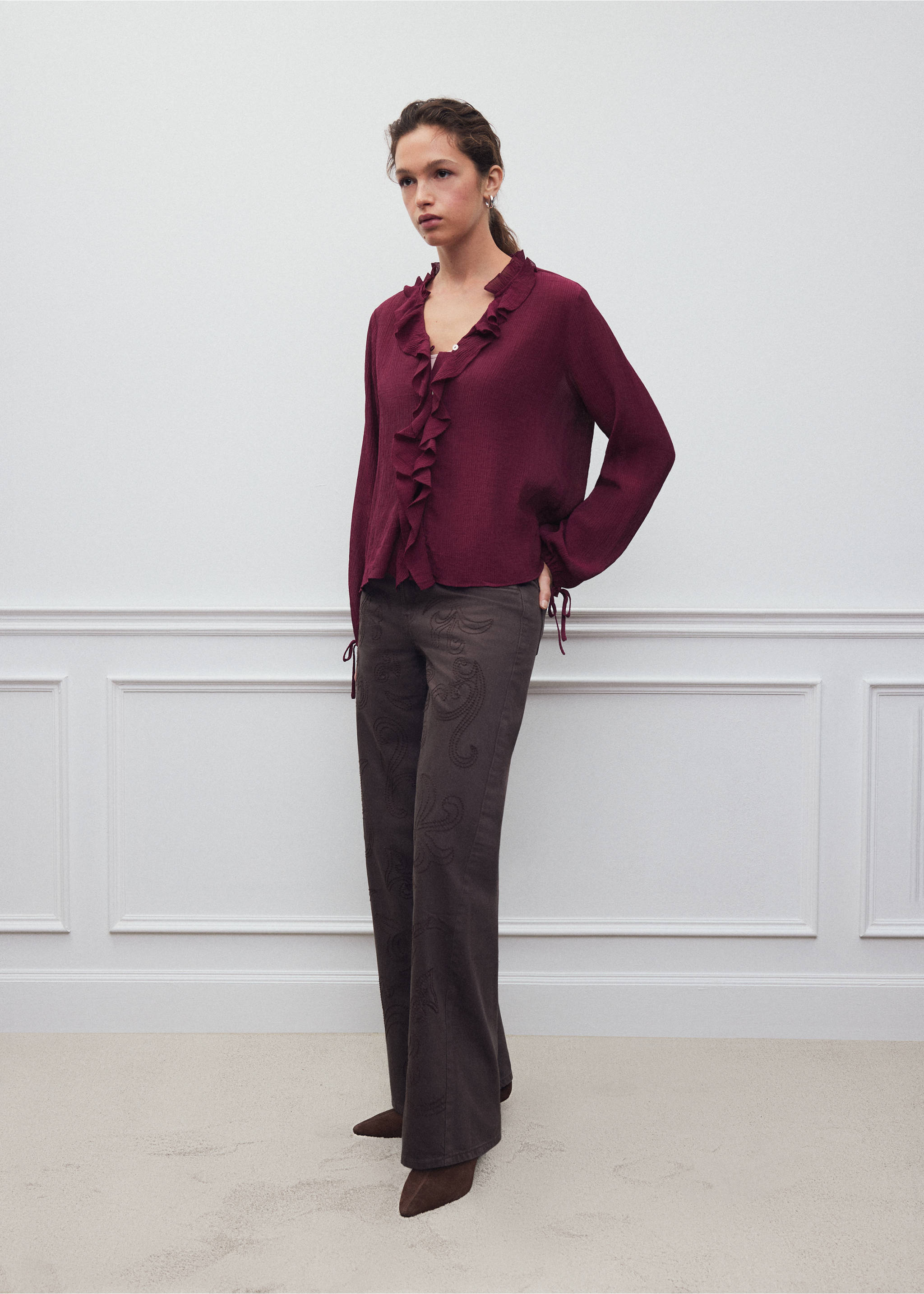 Burgundy long-sleeved shirt with ruffled trim and cuff ties, styled with dark trousers., Blackberry. Ref: 37048274-00.