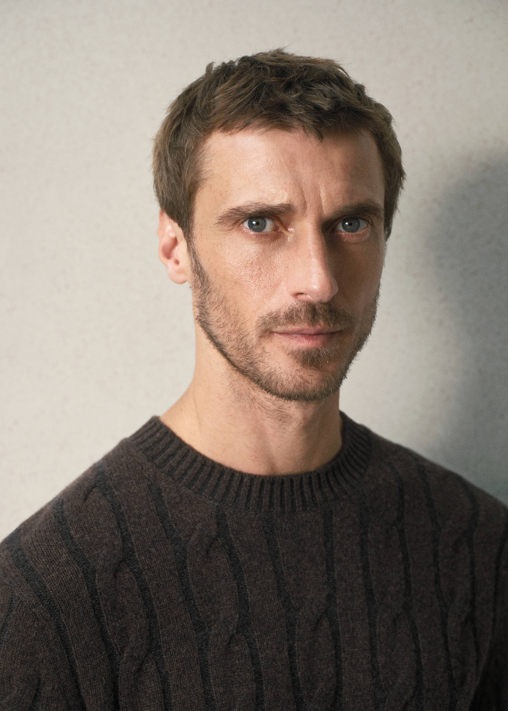 Dark brown cable-knit crew neck sweater