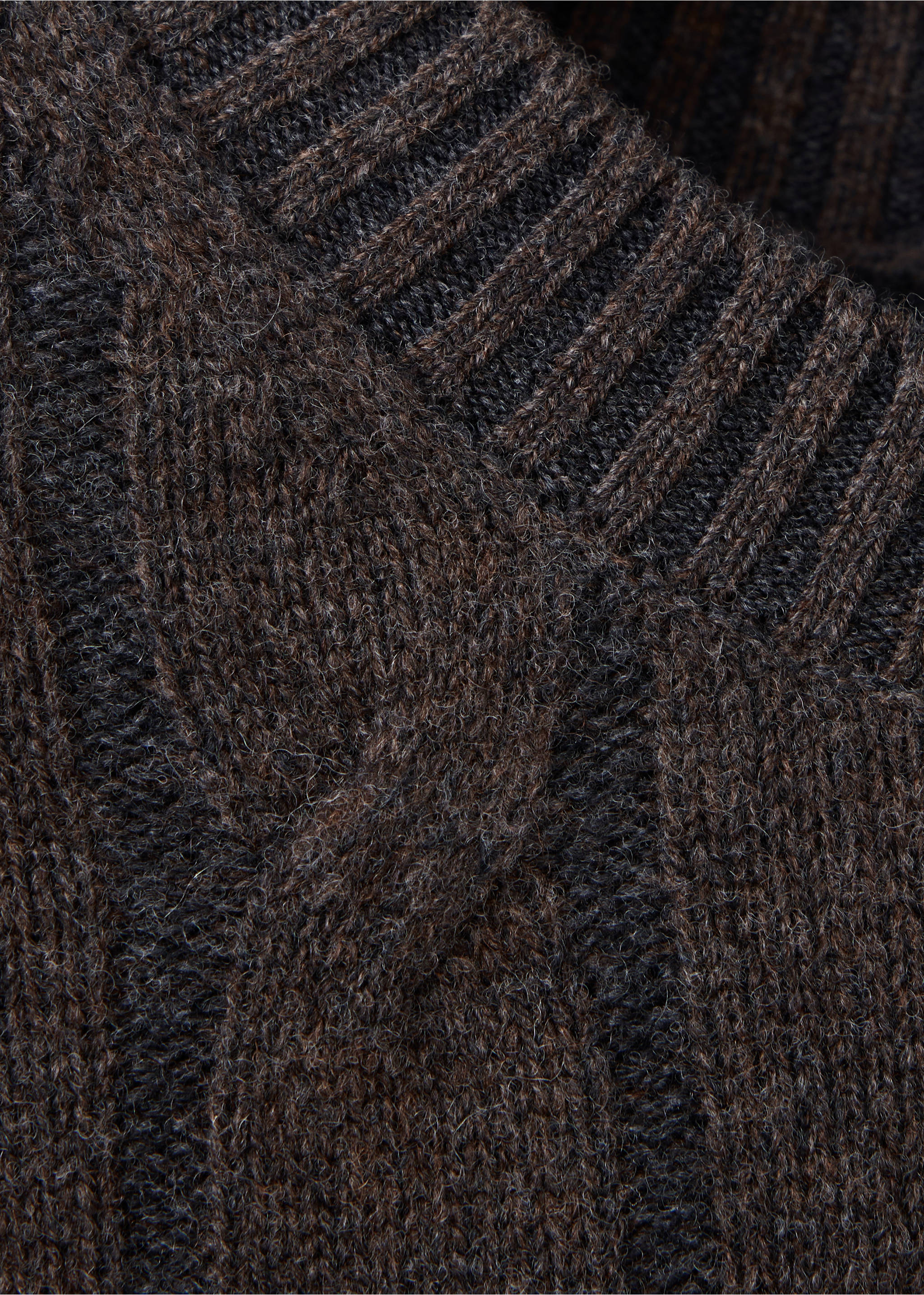 Close-up of a dark brown cable-knit V-neck sweater., Chocolate. Ref: 37048275-00.