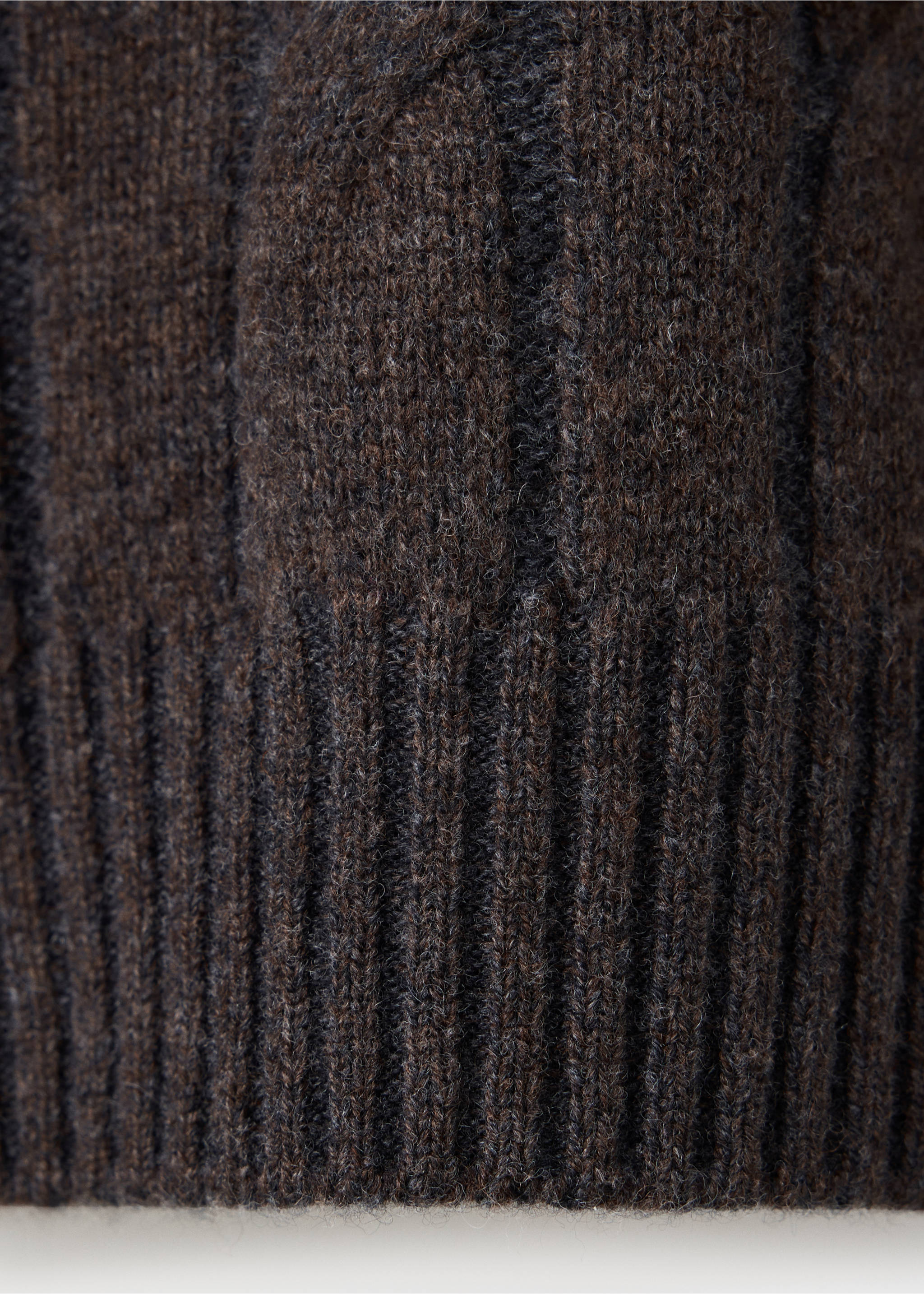 Close-up of a dark brown men's knit sweater showing texture and ribbed hem., Chocolate. Ref: 37048275-00.