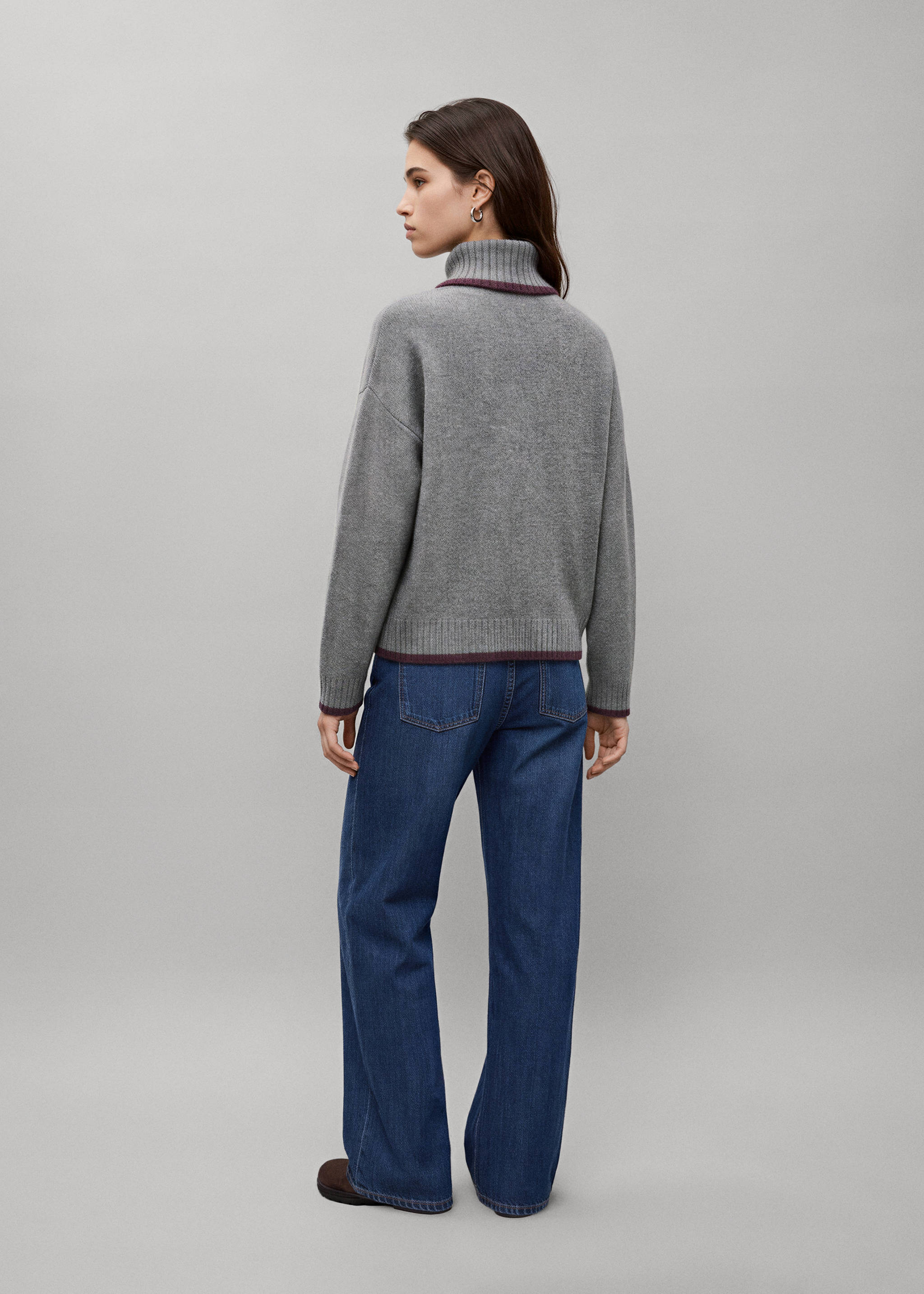 Grey jersey with roll neck and dark trim, back view.