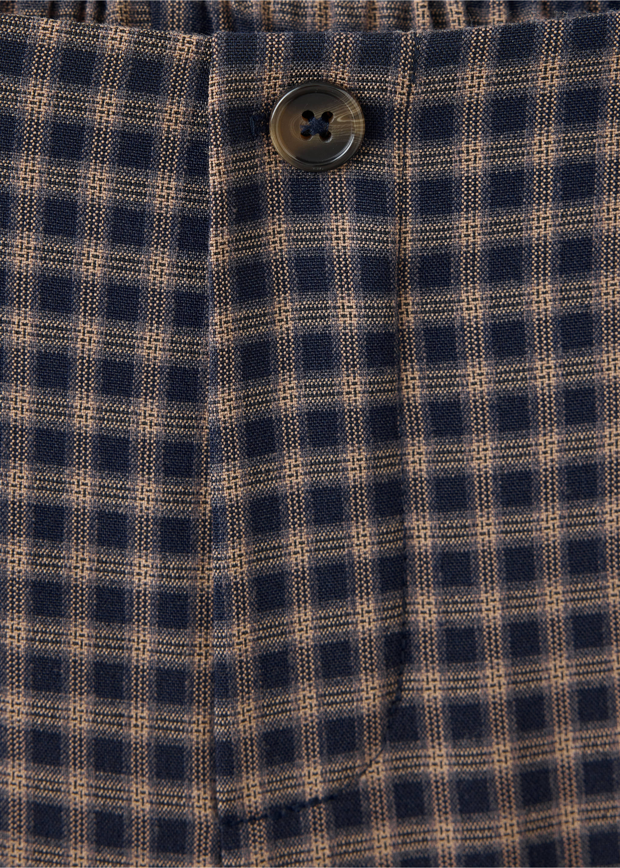 Close-up of navy and brown check children's trousers with button detail., Navy. Ref: 37048286-00.