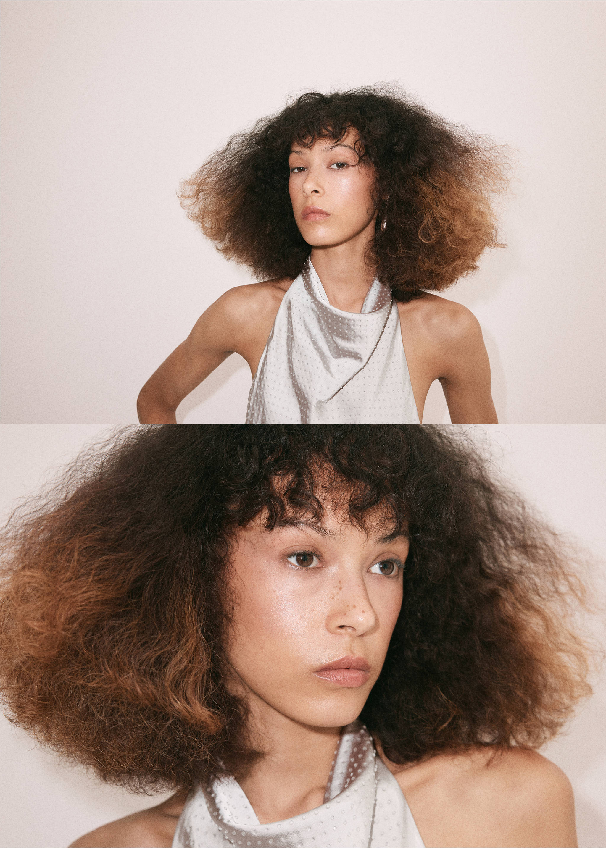 Close-up of a model wearing a light-coloured halter top with a high draped neckline and subtle dot pattern., Grey. Ref: 37049121-00.
