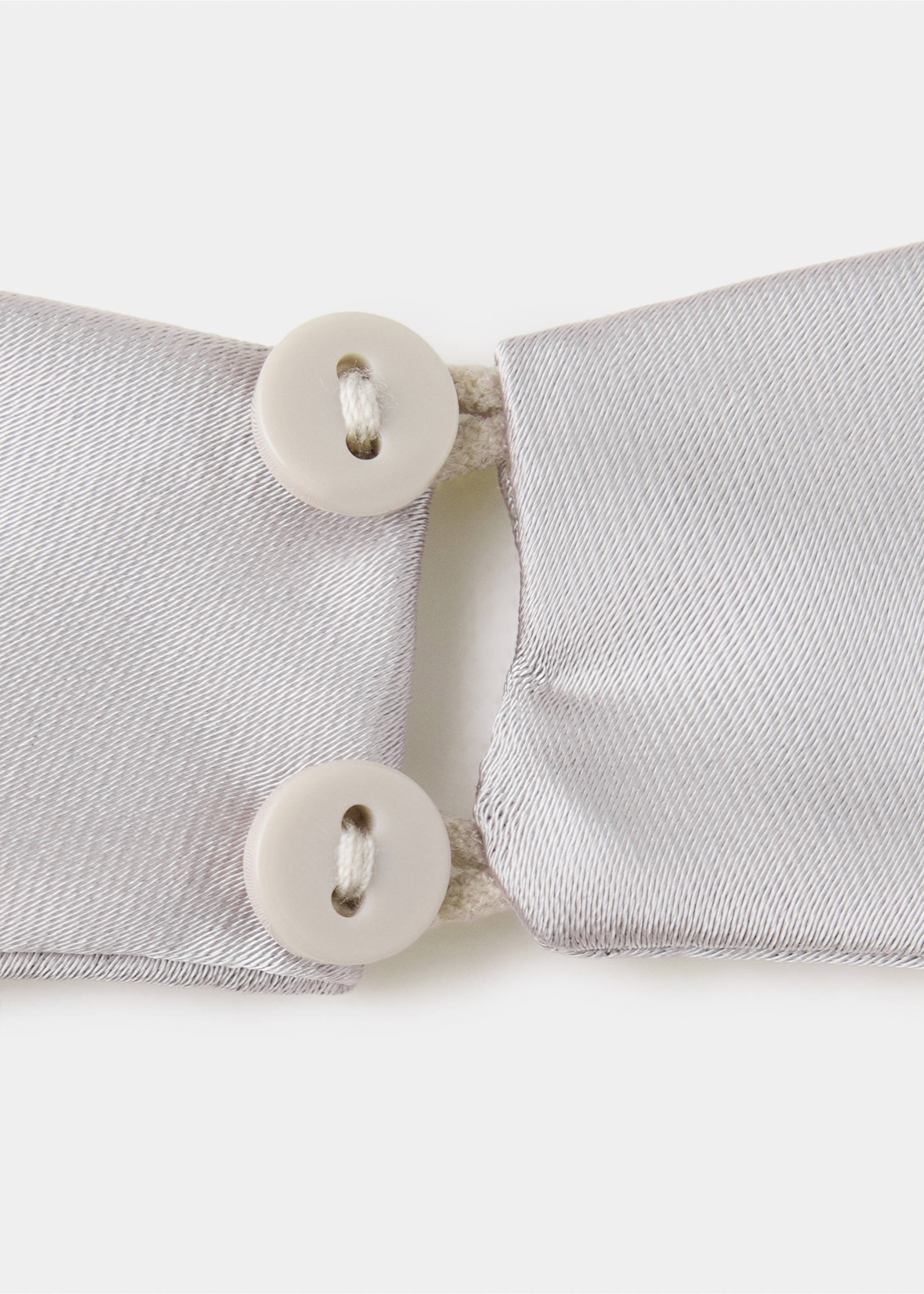 Close-up of a silver top featuring button closure detail., Grey. Ref: 37049121-00.