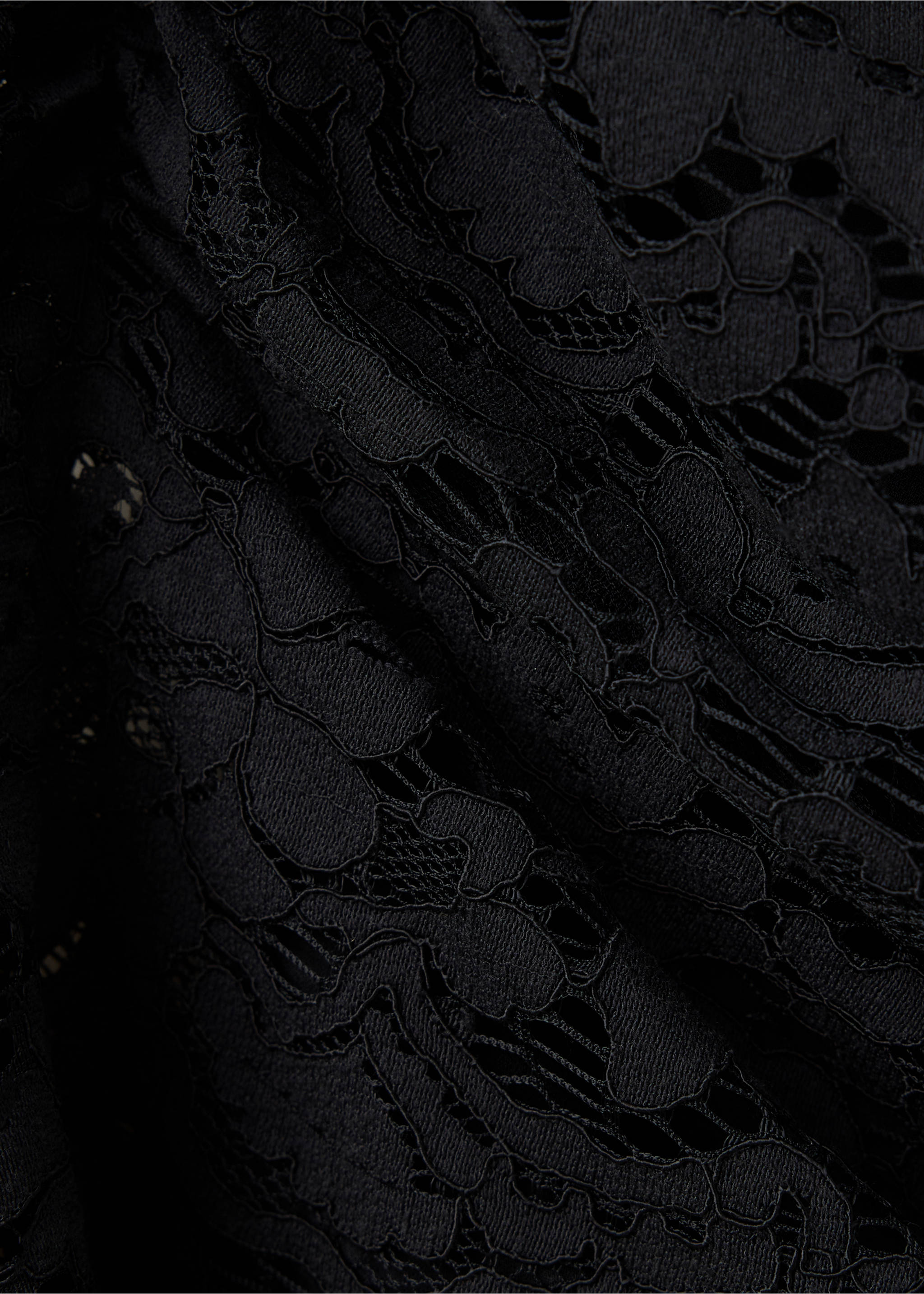 Close-up of a black lace top showing the intricate floral pattern., Black. Ref: 37049122-00.