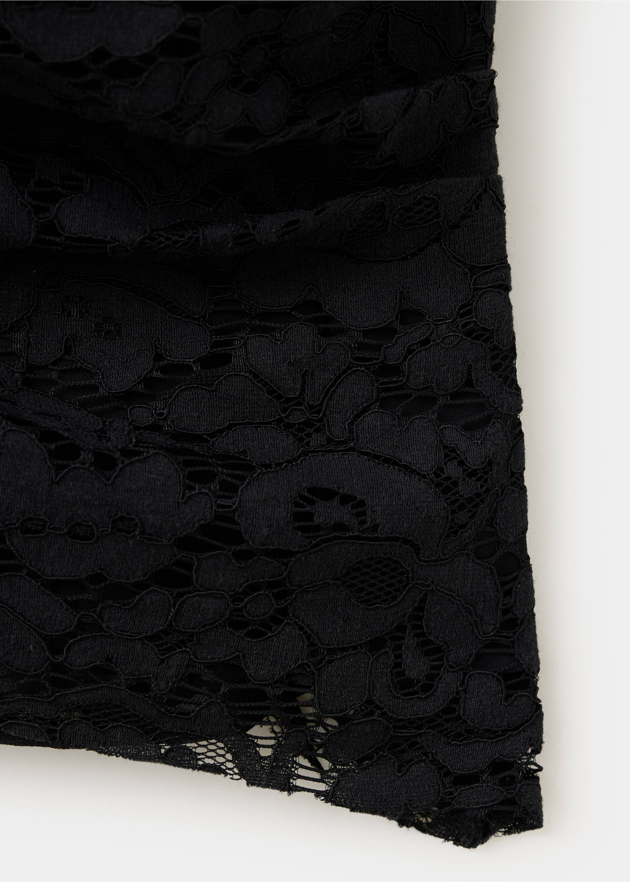Close-up of a black top showing intricate floral lace fabric detail., Black. Ref: 37049122-00.