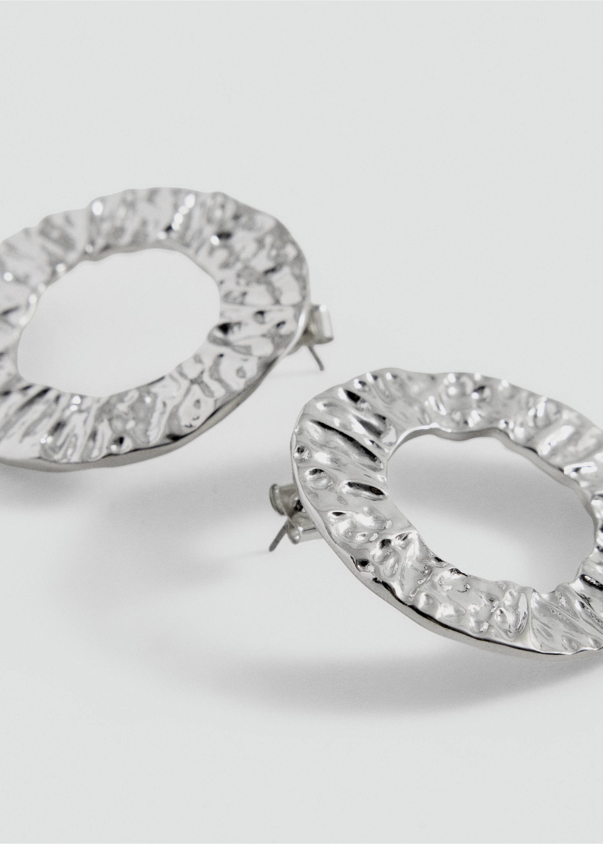 Silver-toned hammered hoop earrings with a textured surface., Silver. Ref: 37049127-00.