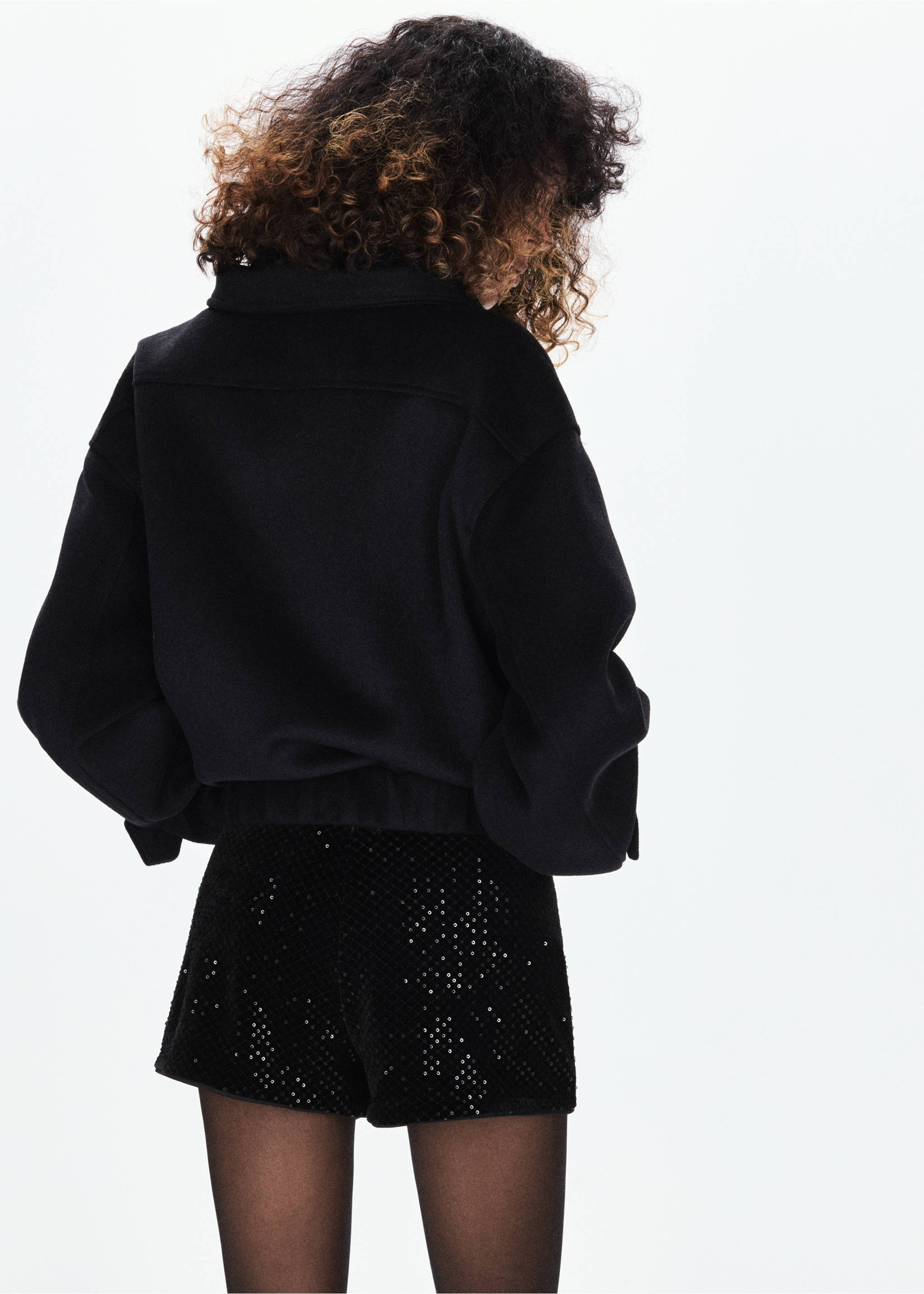 Black sequin shorts, shown from the back., Black. Ref: 37049129-00.