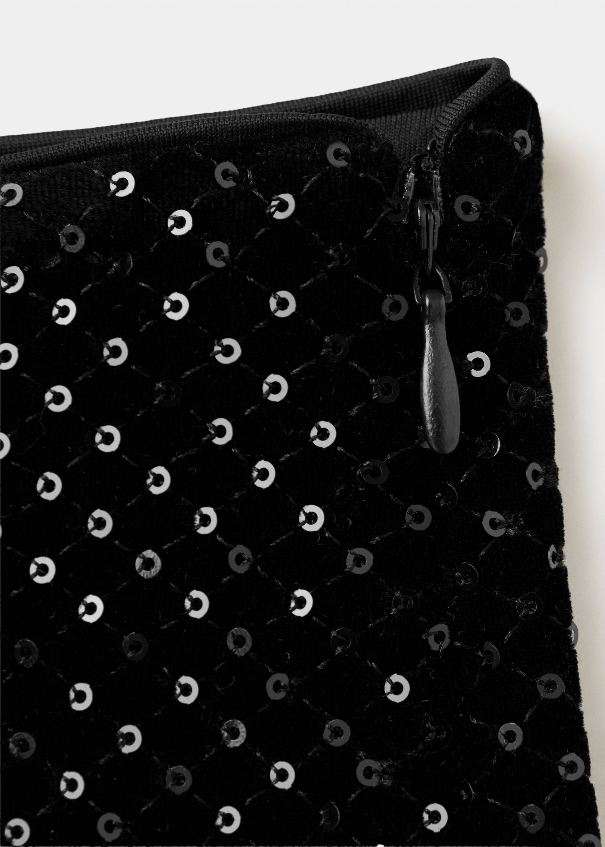 Close-up of black shorts with quilted sequin detail and side zipper., Black. Ref: 37049129-00.