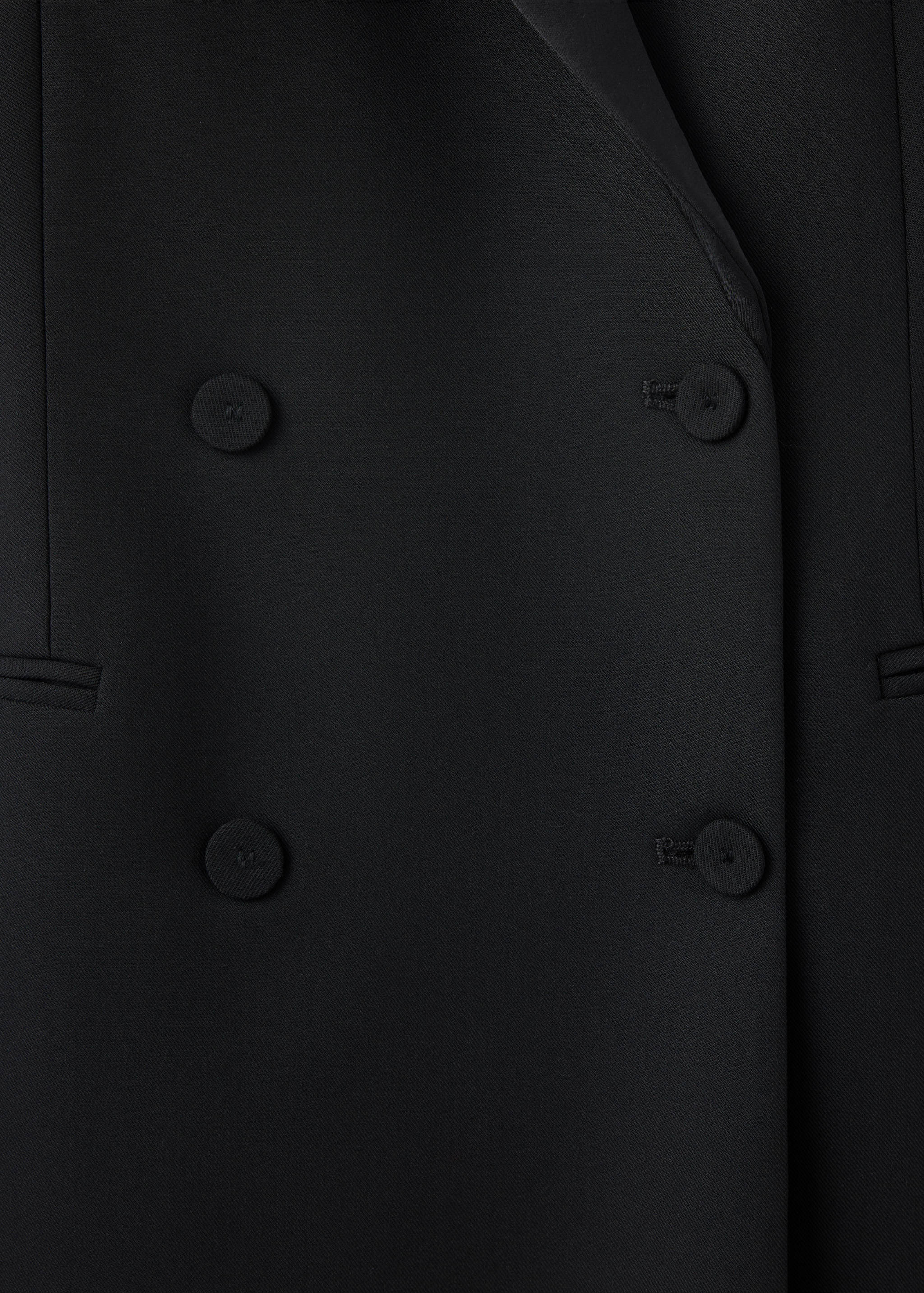Close-up of fabric and double-breasted buttons on a black dress., Black. Ref: 37049131-00.