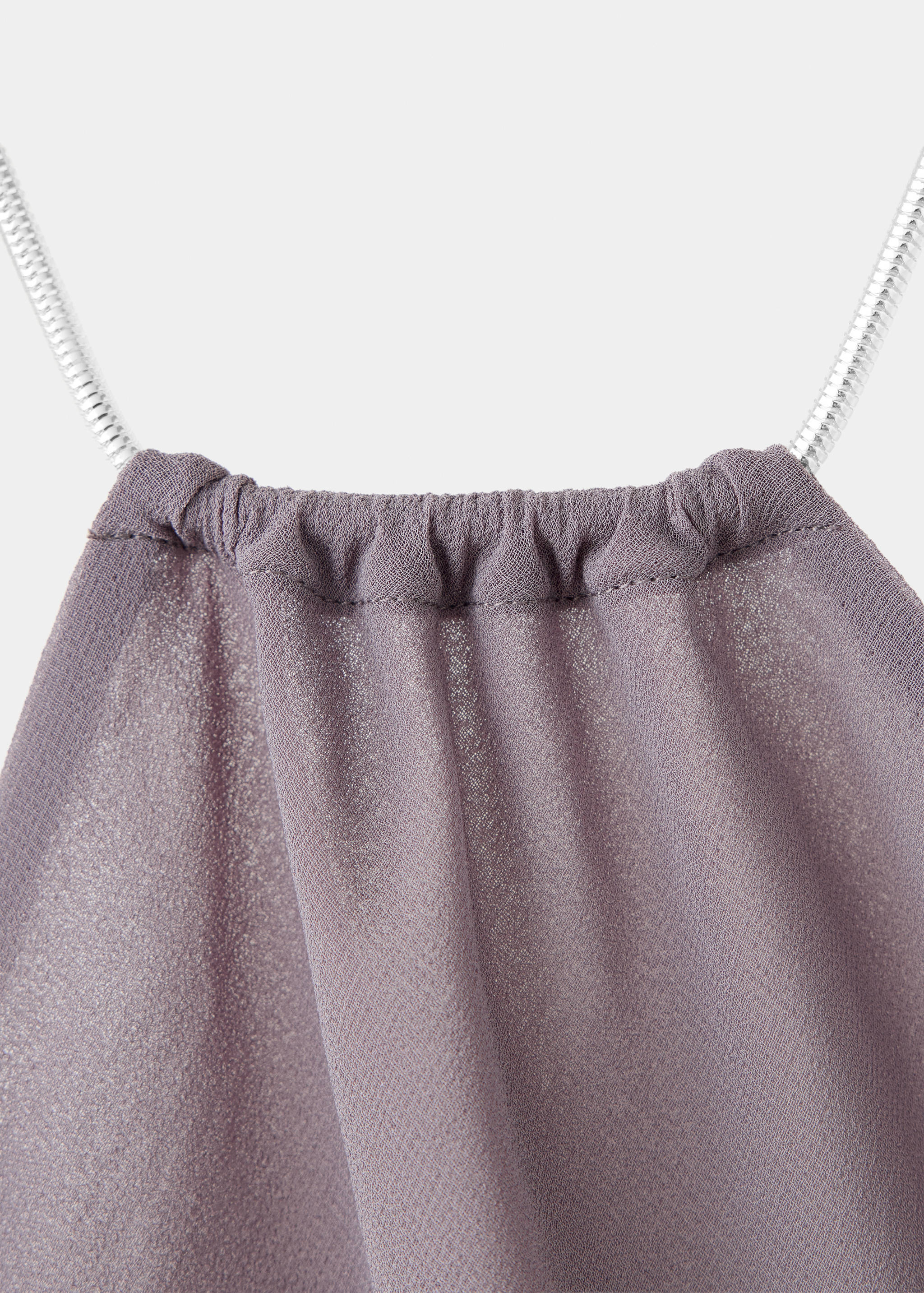 Mauve dress detail with a gathered neckline and thin metallic straps.
