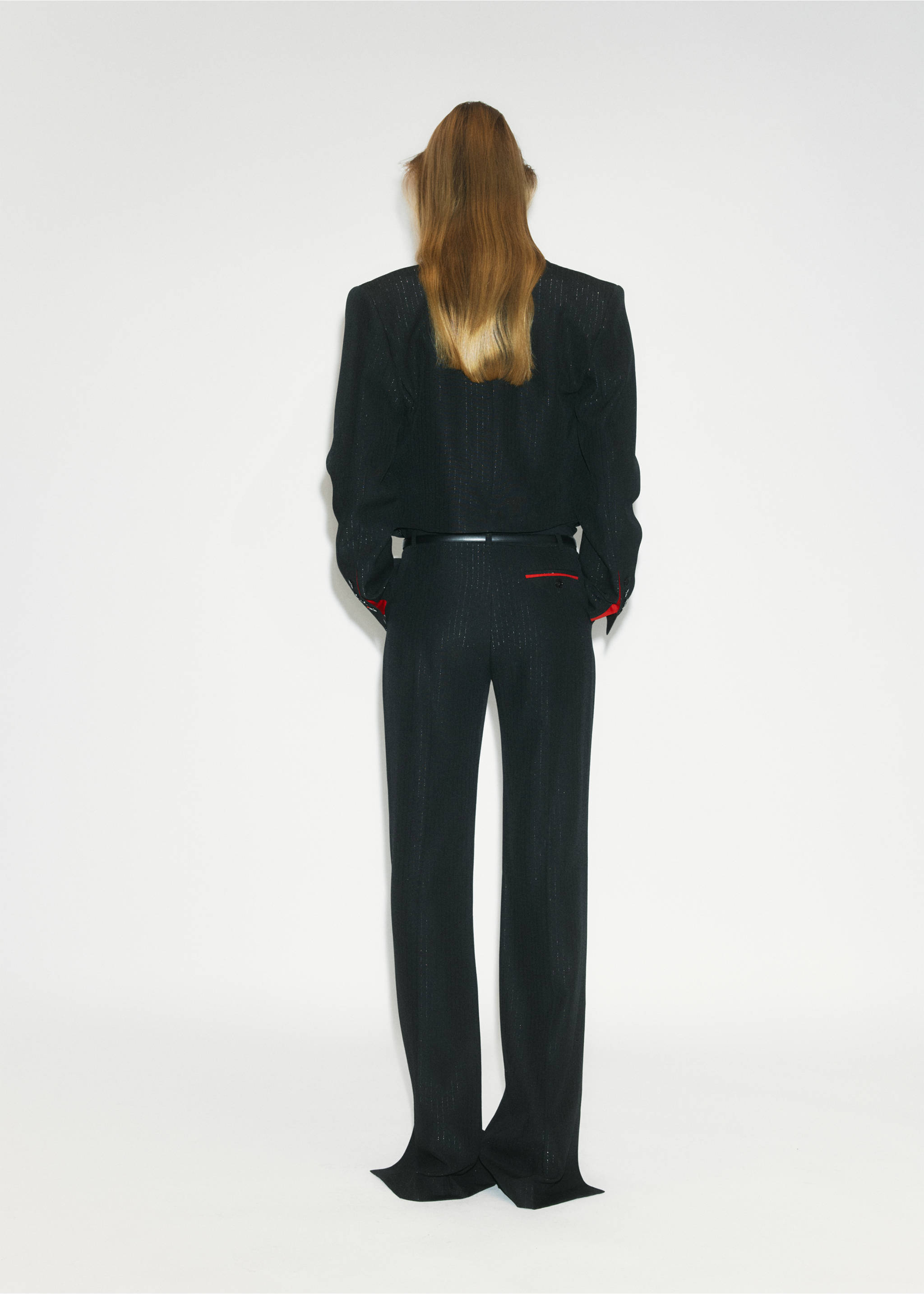 Back view of a black structured blazer with padded shoulders and matching trousers., Black. Ref: 37049144-00.