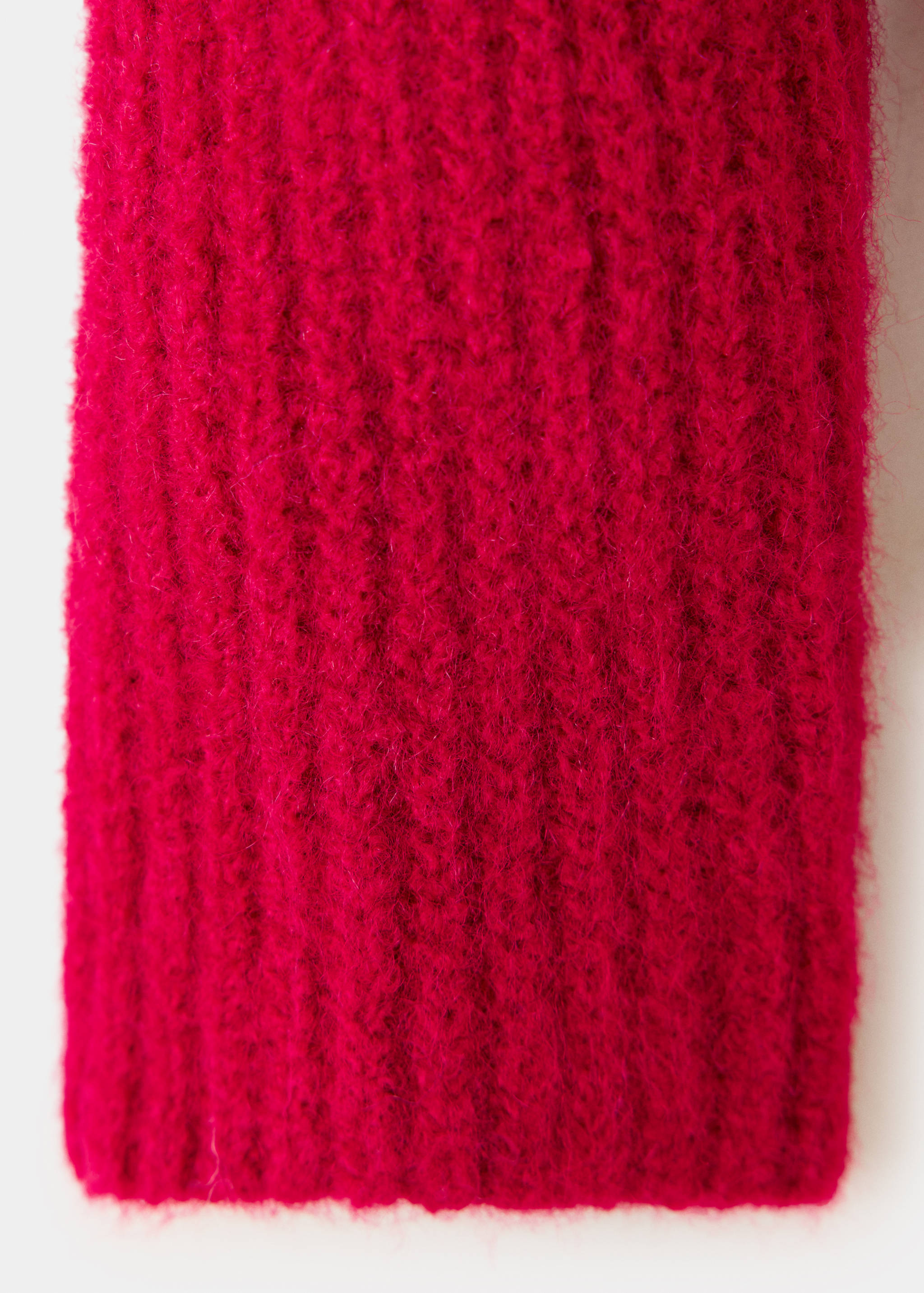 Bright pink knit cardigan fabric detail showing fuzzy texture.