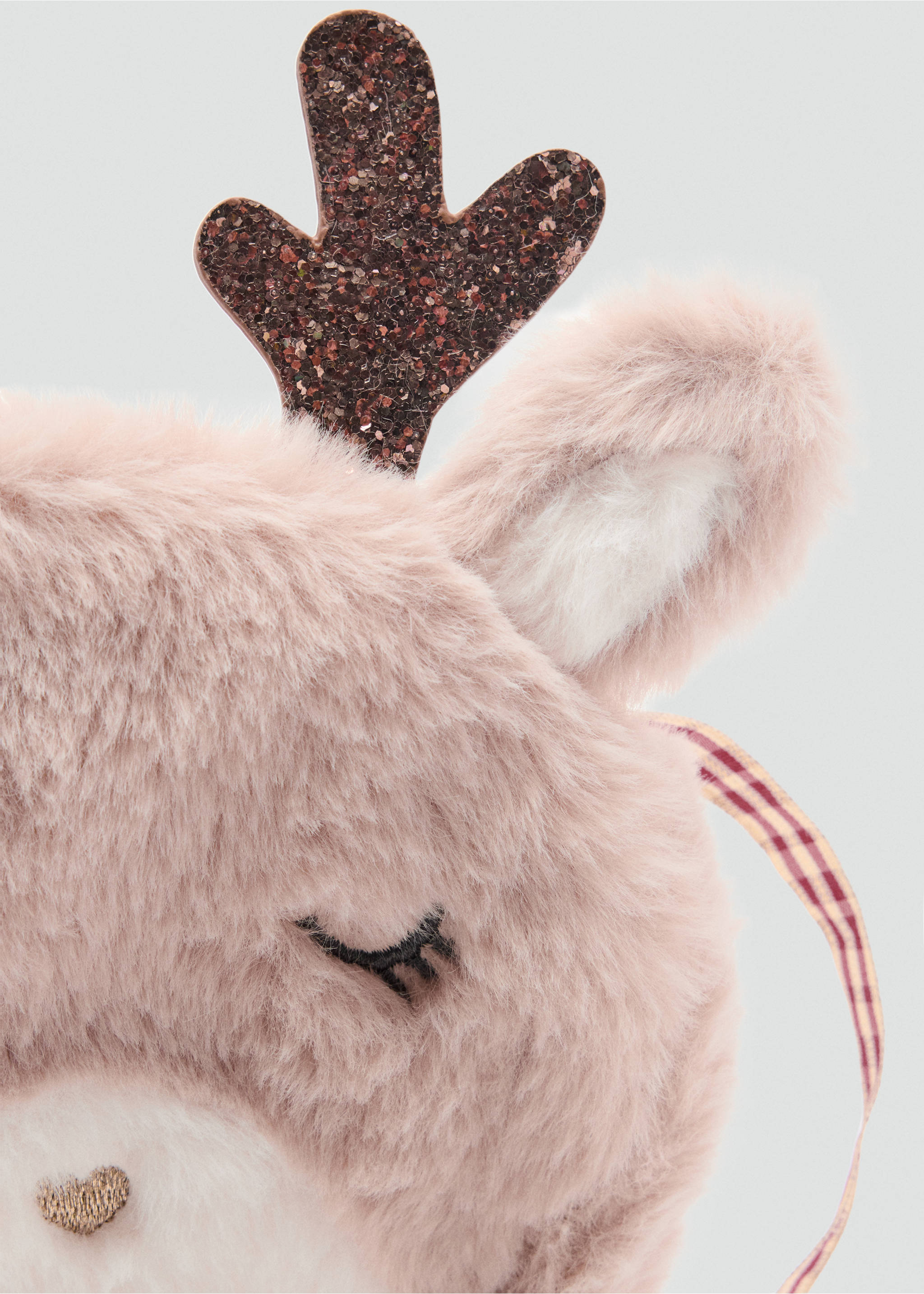 Pink faux-fur mini bag detail with eyelashes and glitter antler, Sand. Ref: 37049218-00.
