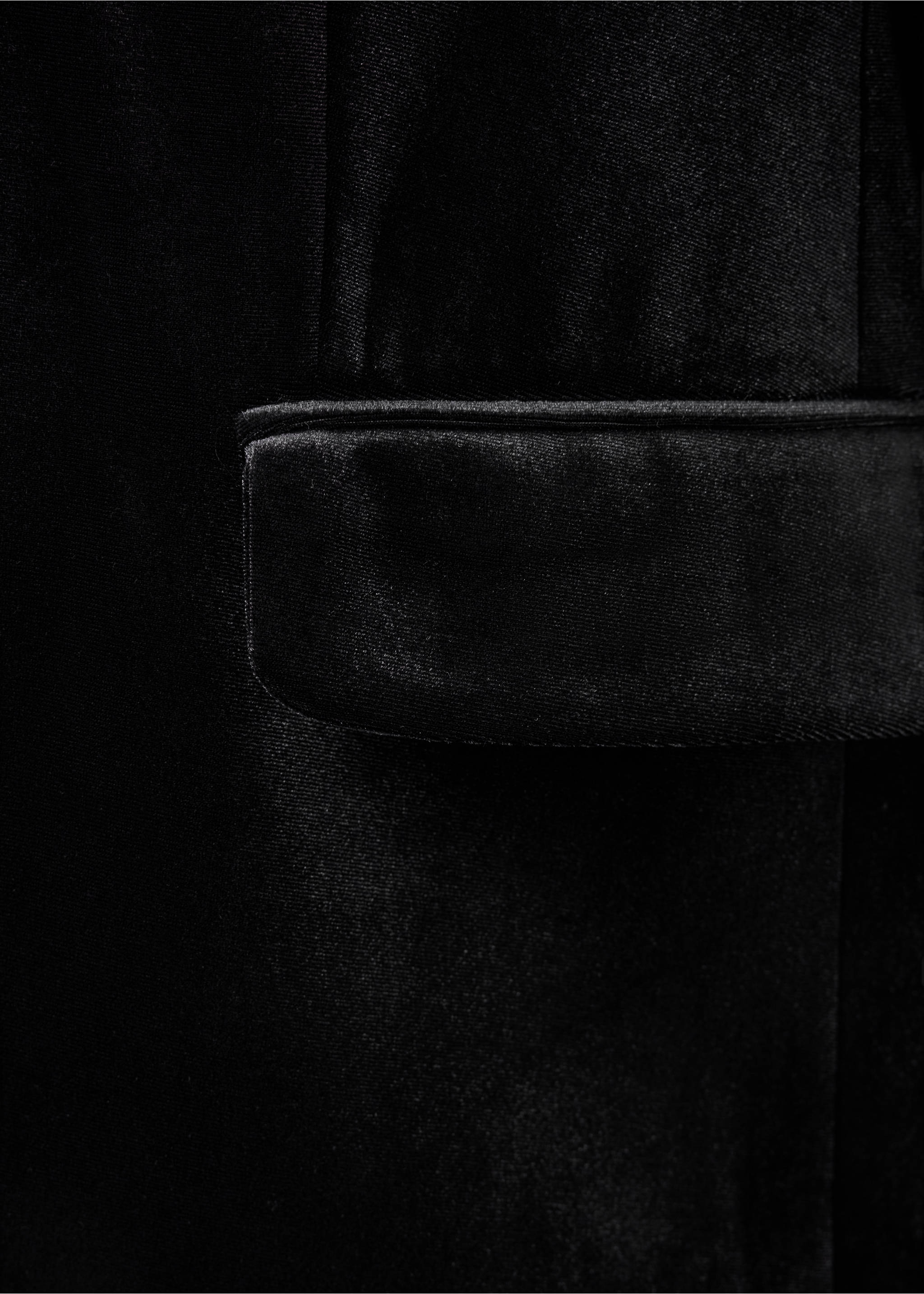 Close-up of a black velvet blazer showing a pocket detail., Black. Ref: 37049221-00.