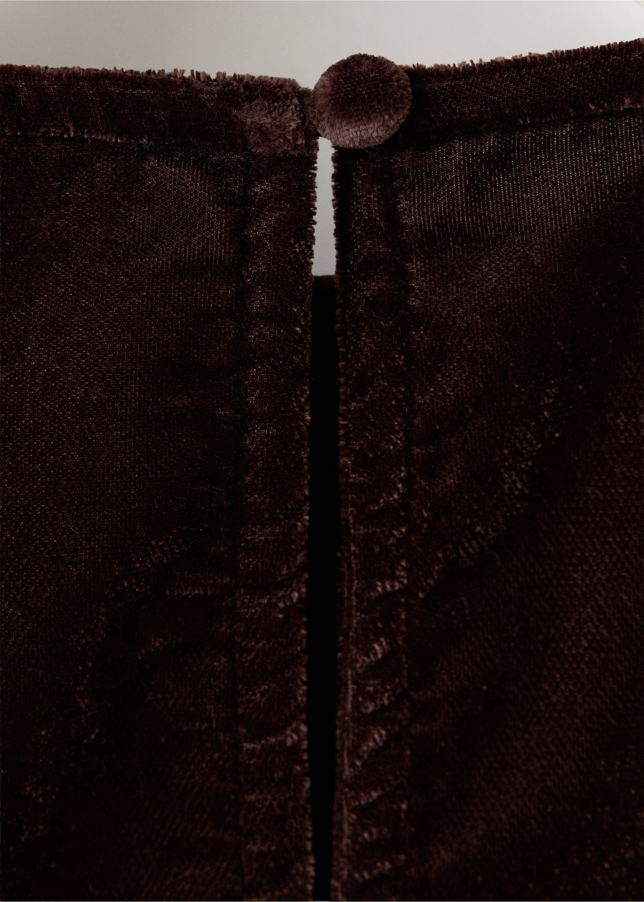 Close-up of the textured fabric and back button detail on a dark brown blouse., Burgundy. Ref: 37049404-00.