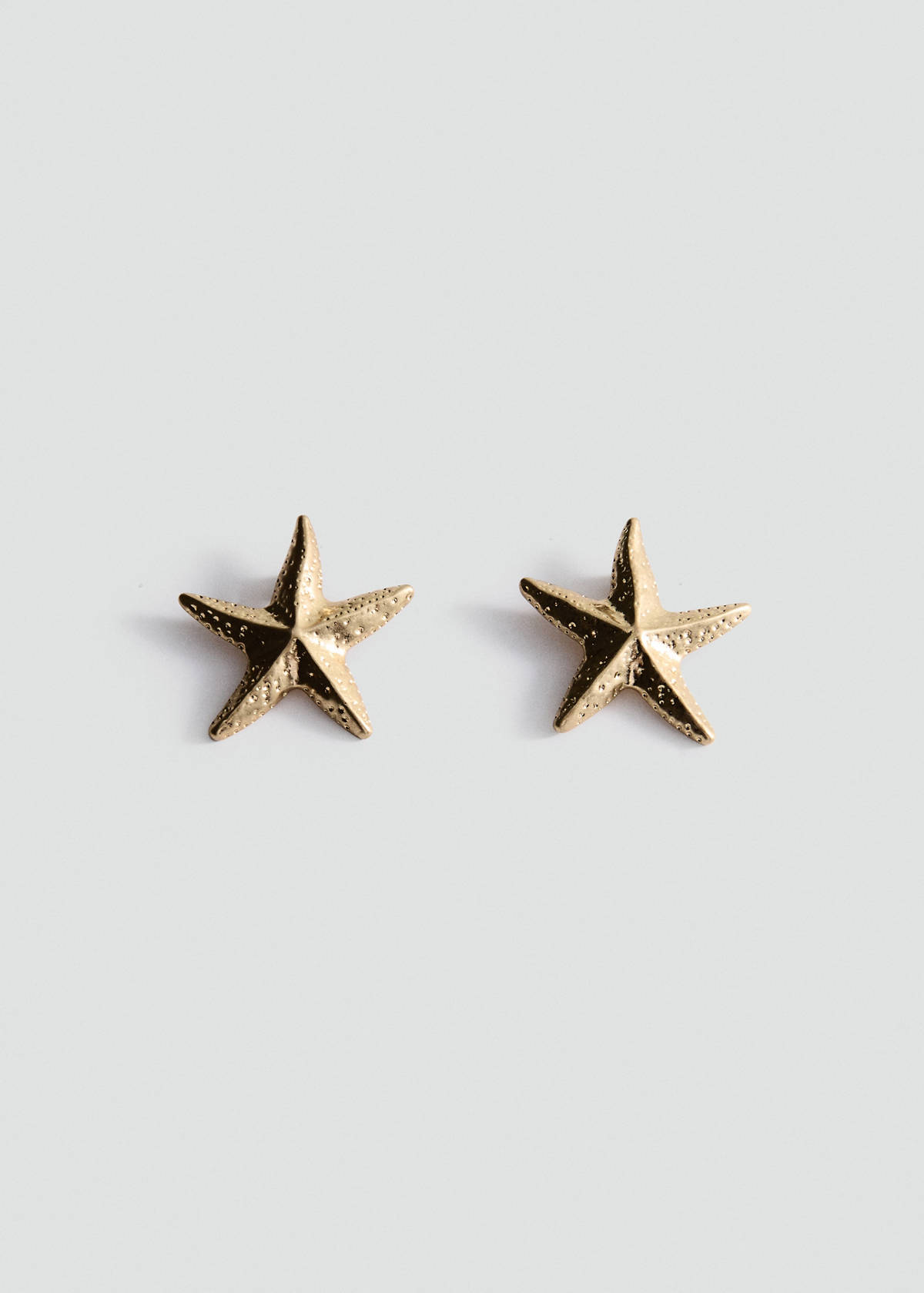 Star design earrings — Gold