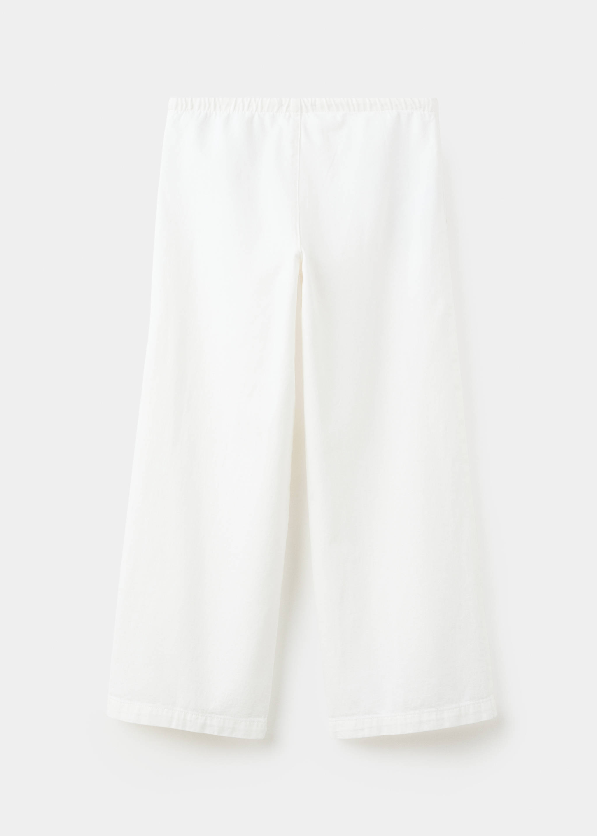 Studded long trousers - Reverse of the article