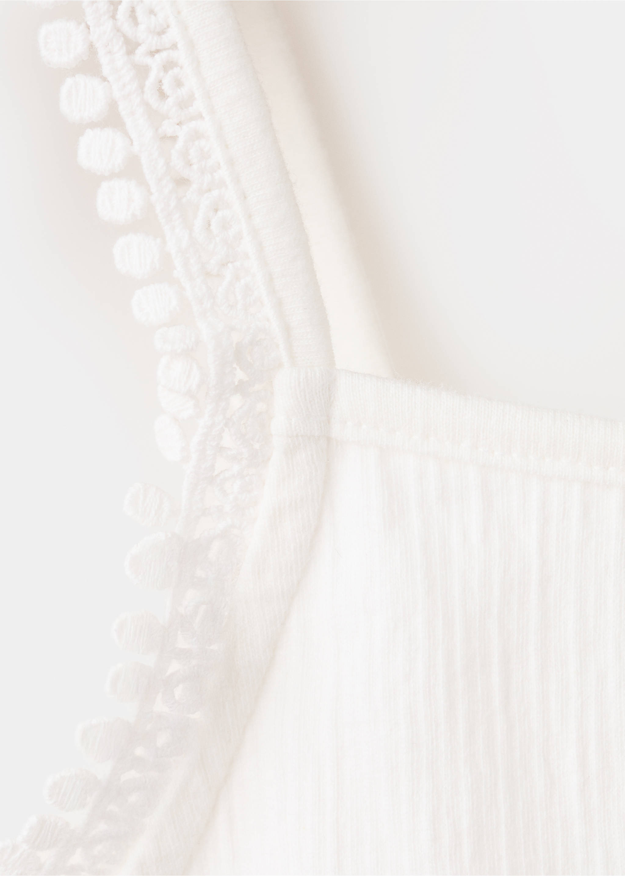 Sleeveless vest with embroidered details - Details of the article 8, Off White. Ref: 37051355-00.