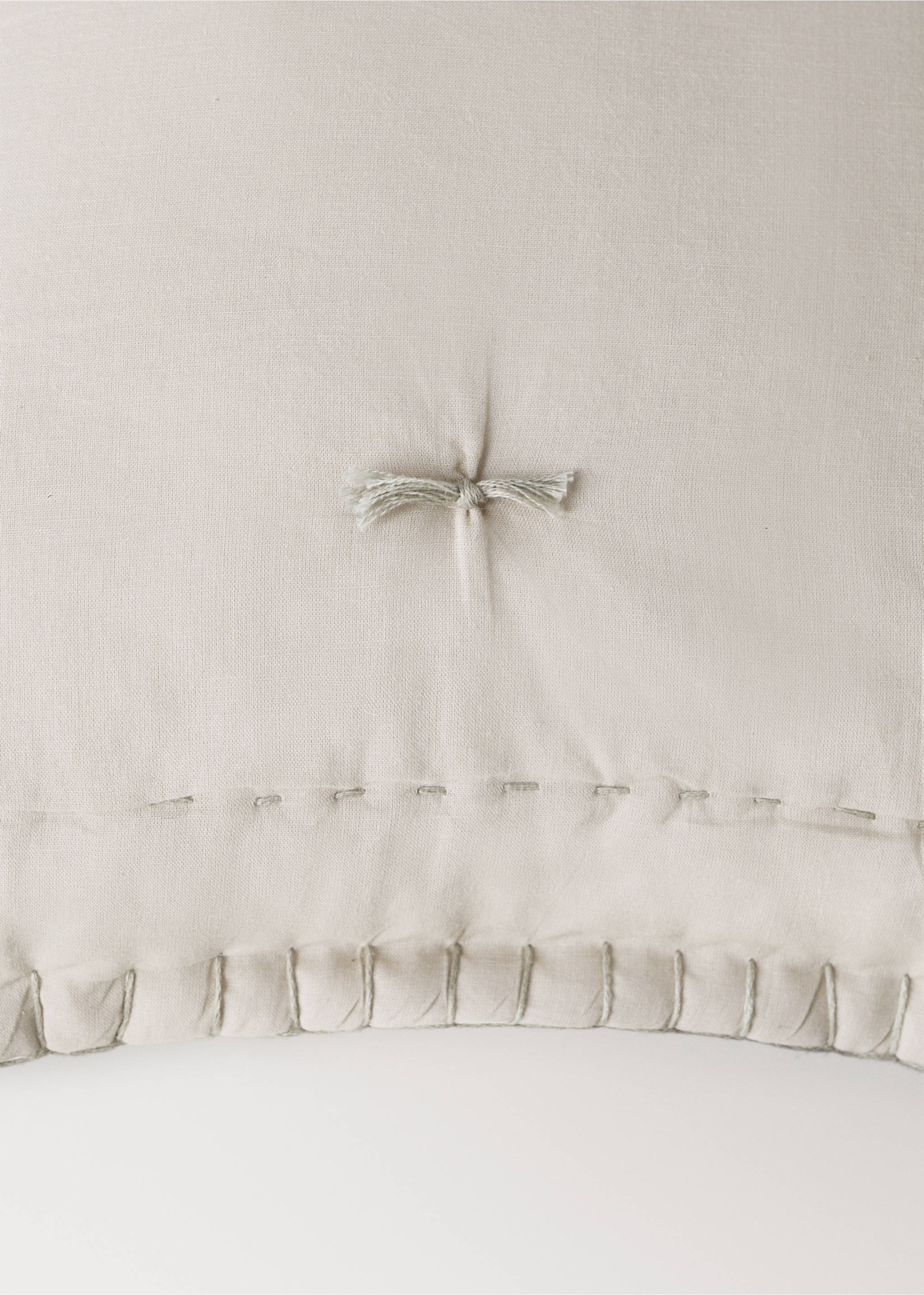 Beige cushion cover detail with tufting and decorative stitching., Grey. Ref: 37051549-00.