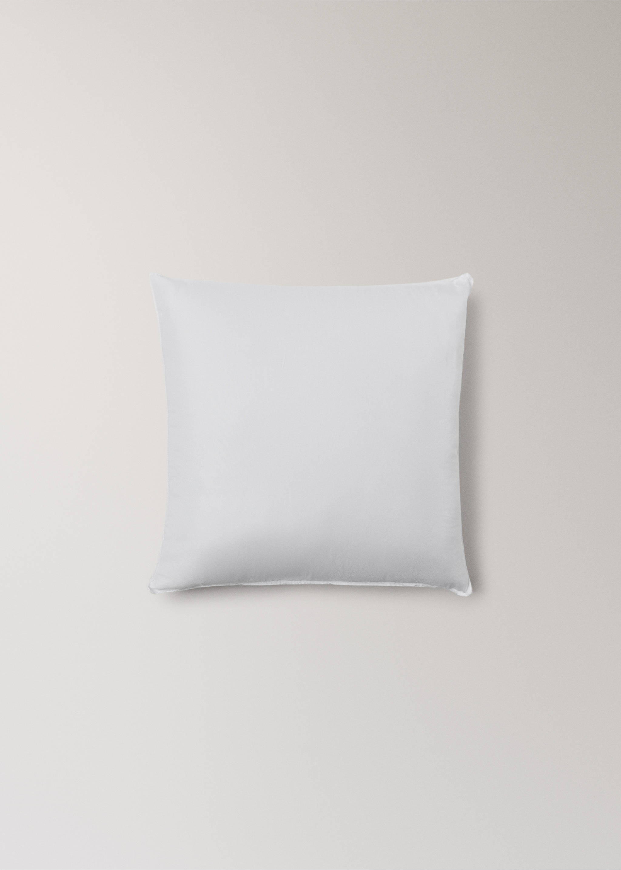 Plain white square pillow insert on a neutral background., White. Ref: 37052563-00.