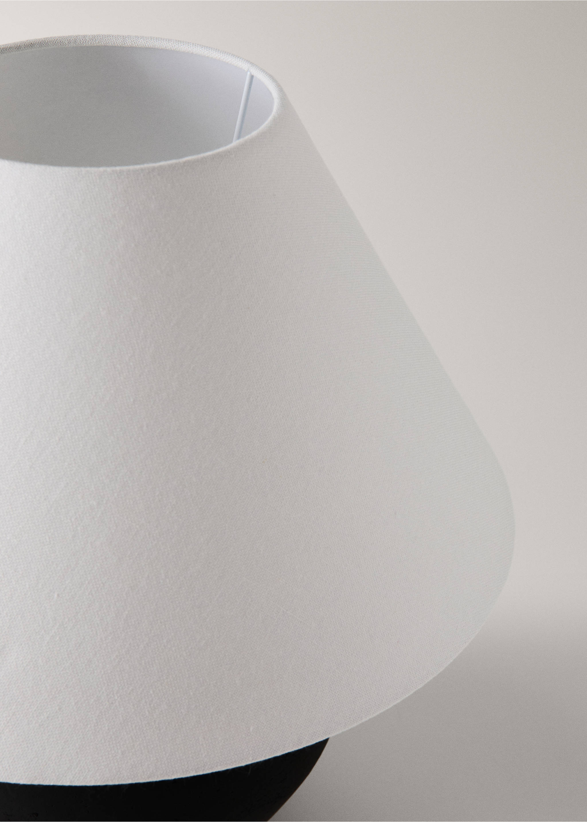 Close-up of a white fabric lamp shade., Black. Ref: 37053860-00.