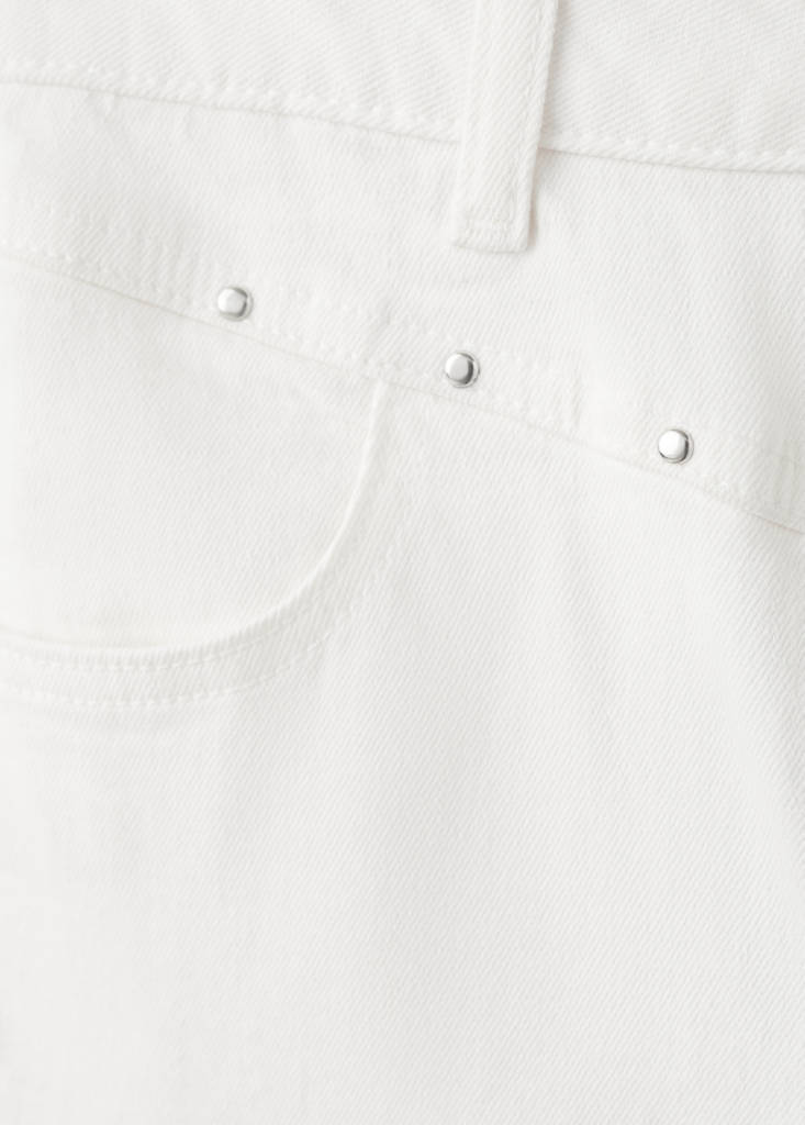Flared jeans with studs — White