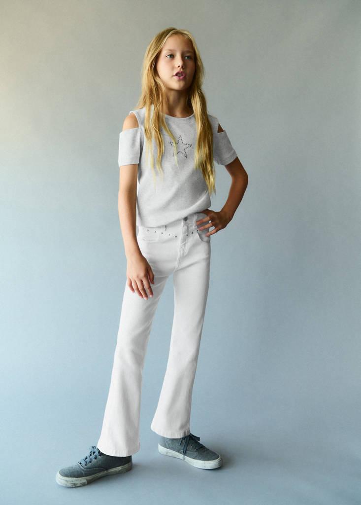 Flared jeans with studs — White