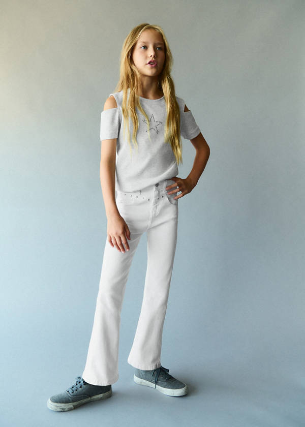 Flared jeans with studs — White