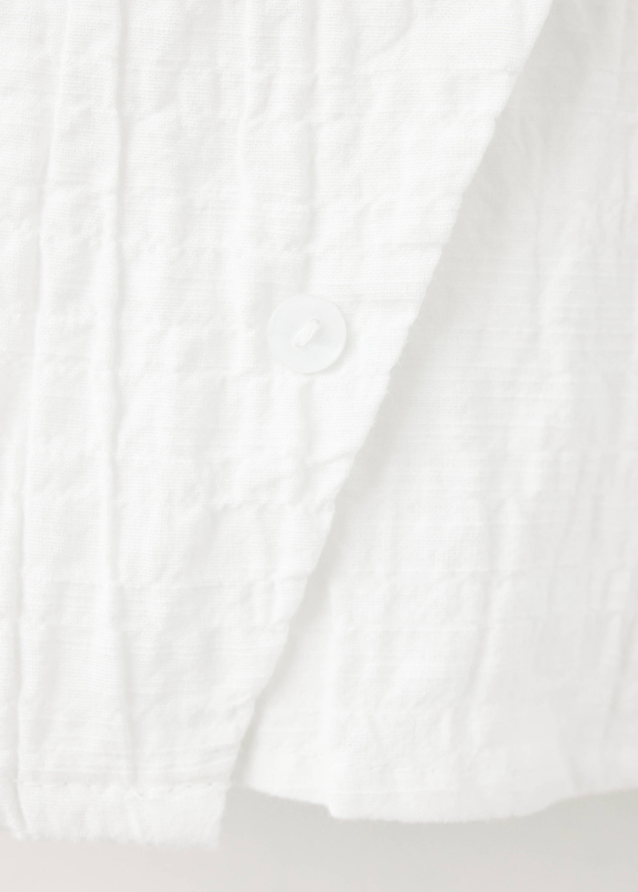 Textured top with slit detail - Details of the article 0