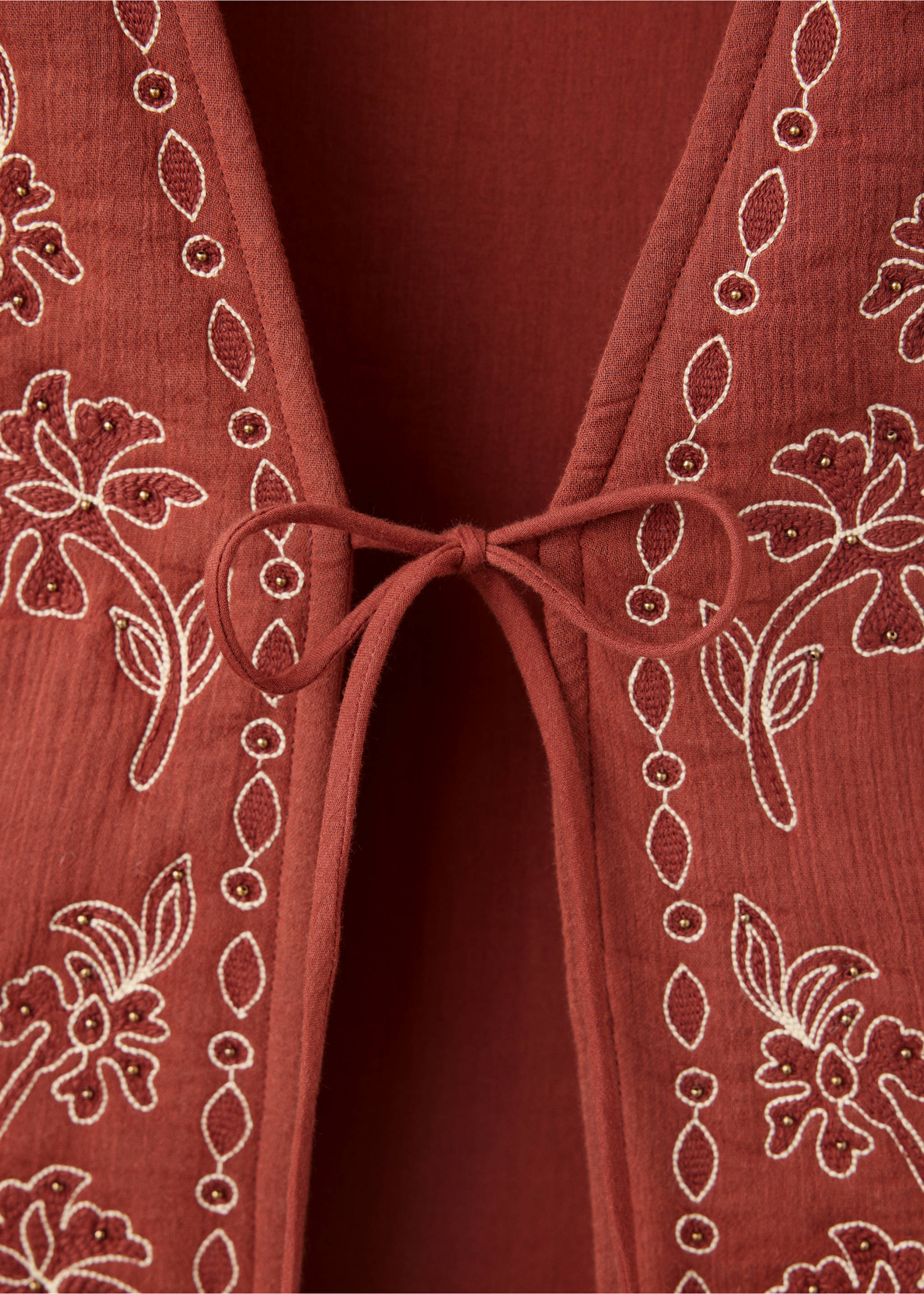Embroidered floral gilet with bow - Details of the article 8, Burnt Orange. Ref: 37054095-00.