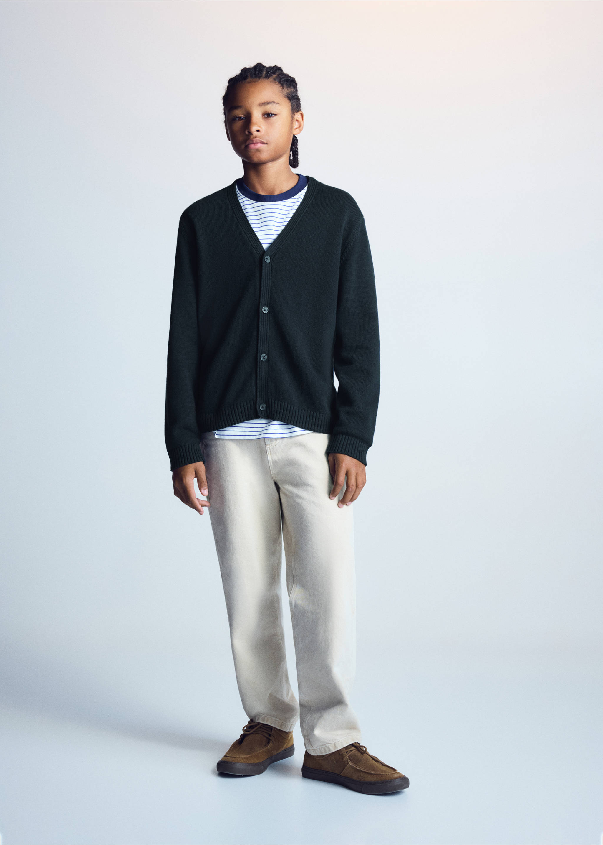 Dark green knitted V-neck cardigan worn with a striped t-shirt and light trousers., Navy. Ref: 37054404-00.