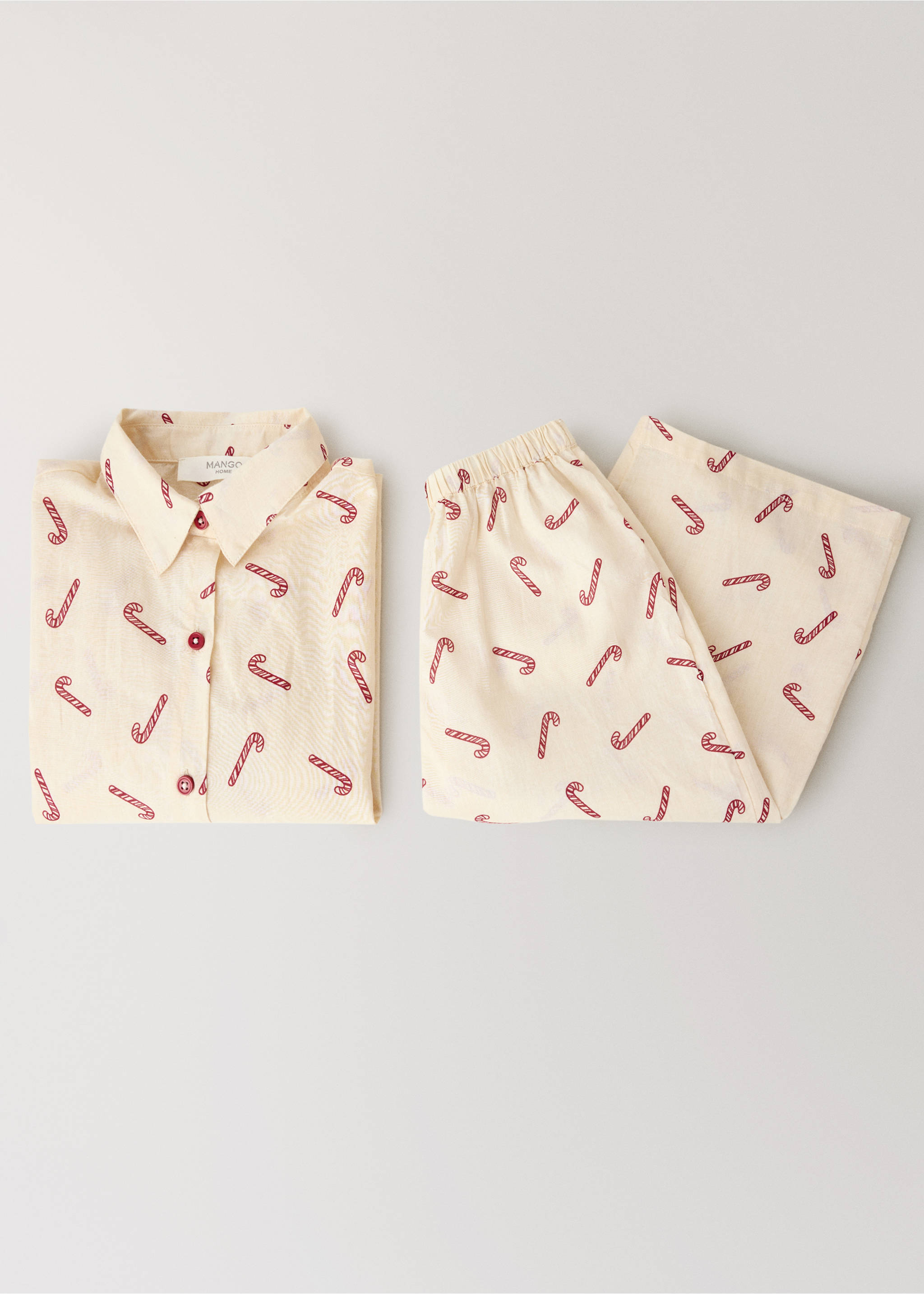 Cream and red candy cane print pajama trousers with an elasticated waistband, shown with a matching shirt., Off White. Ref: 37054452-00.