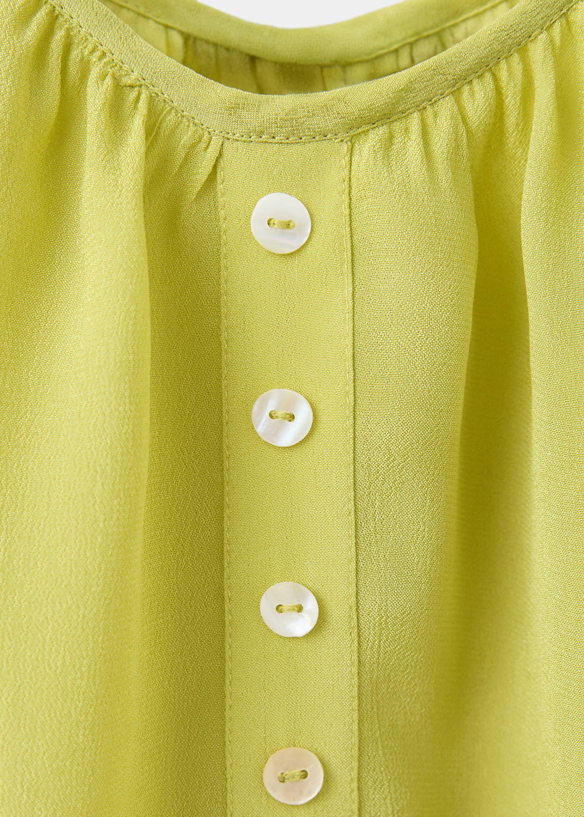 Sleeveless top with decorative buttons — Lime