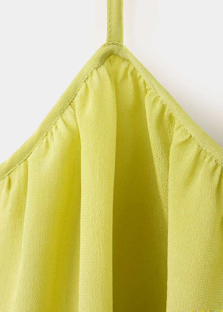 Sleeveless top with decorative buttons — Lime