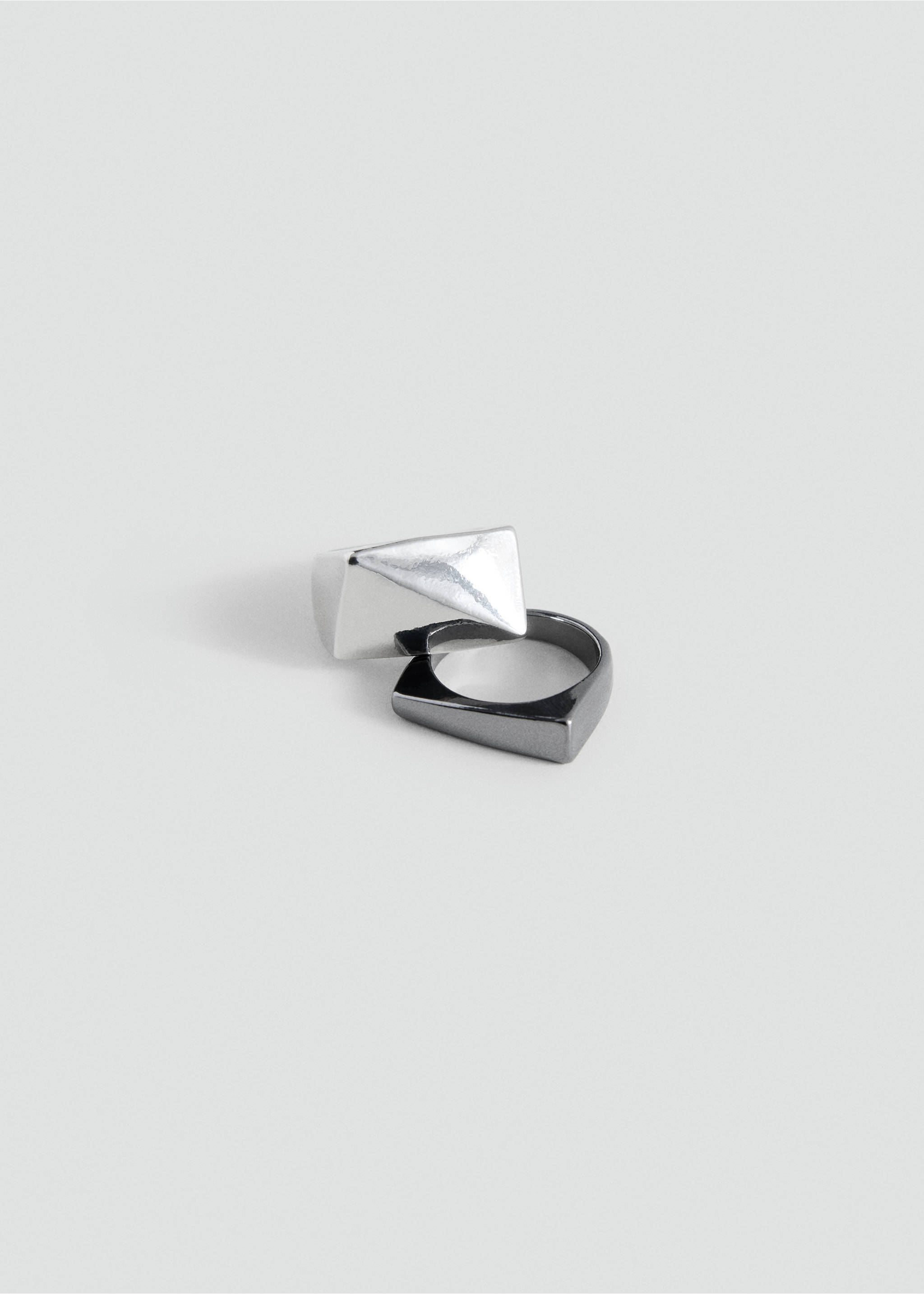 Interlocking silver-tone faceted pyramid ring and dark gunmetal ring., Silver. Ref: 37055177-00.