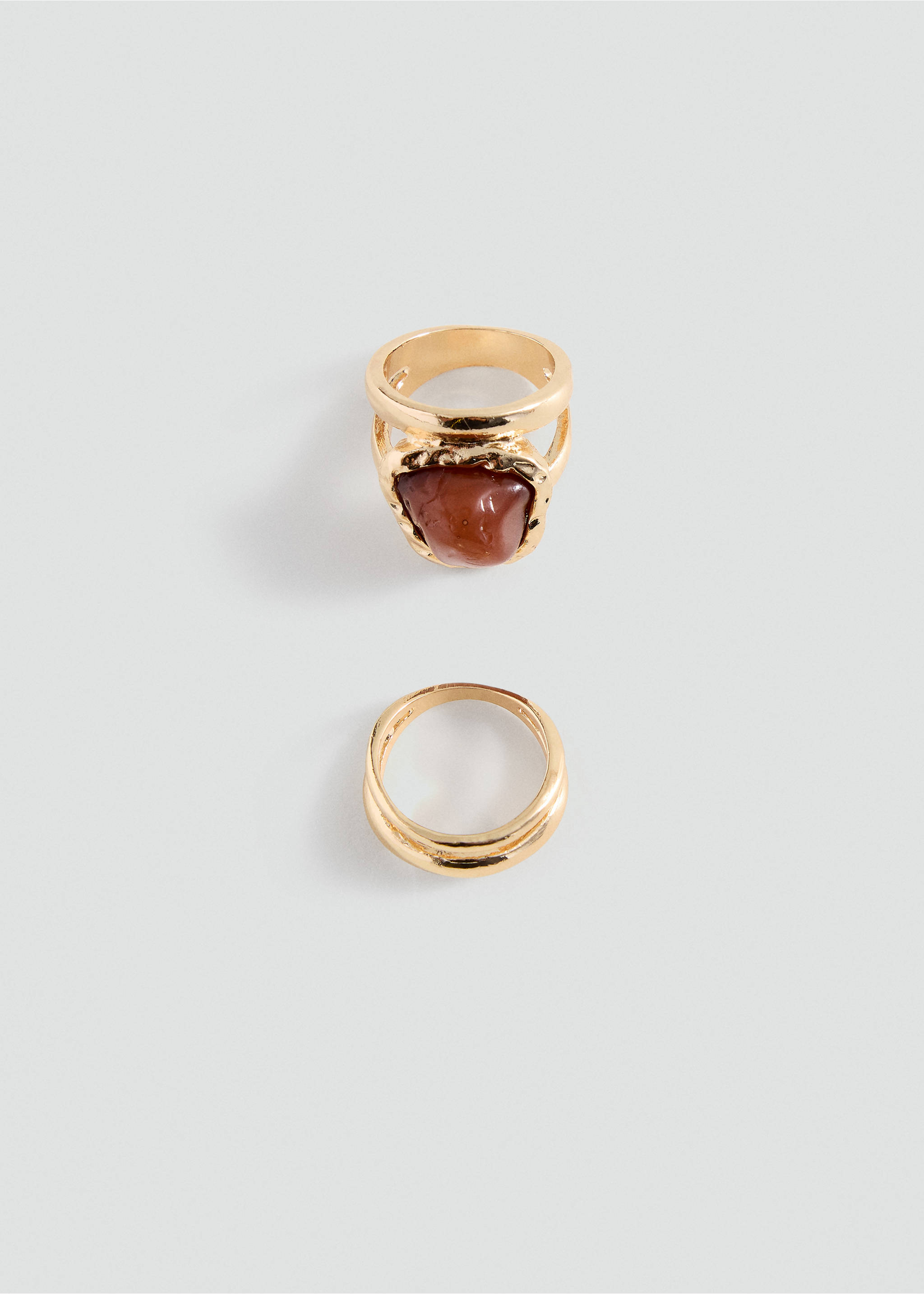 Set of two gold-toned rings, featuring one with a reddish-brown stone., Gold. Ref: 37055178-00.