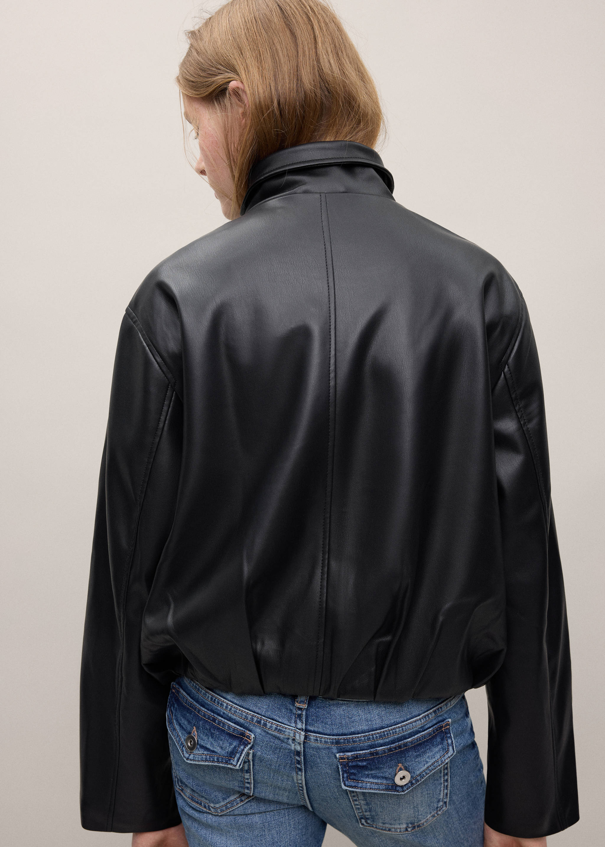 Funnel neck jacket with pockets - Reverse of the article