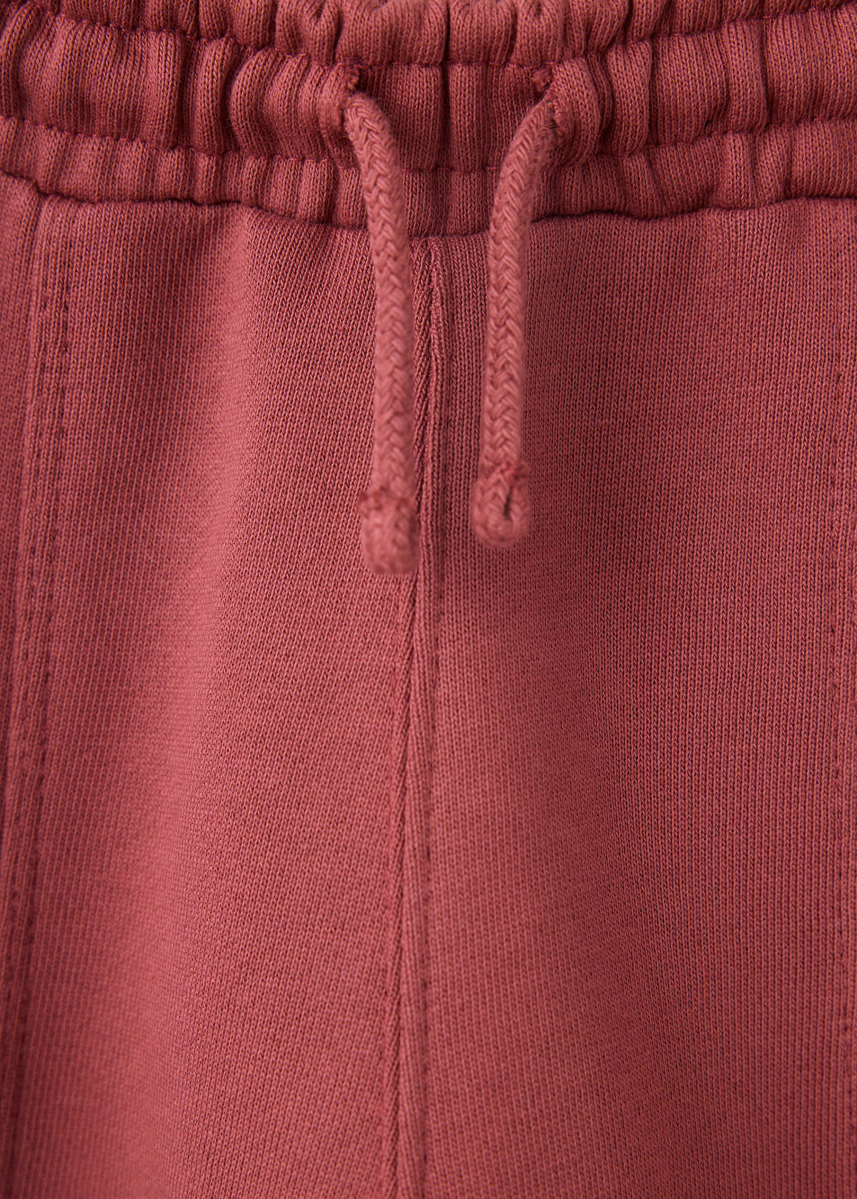 Jogger trousers with seam detail — Maroon
