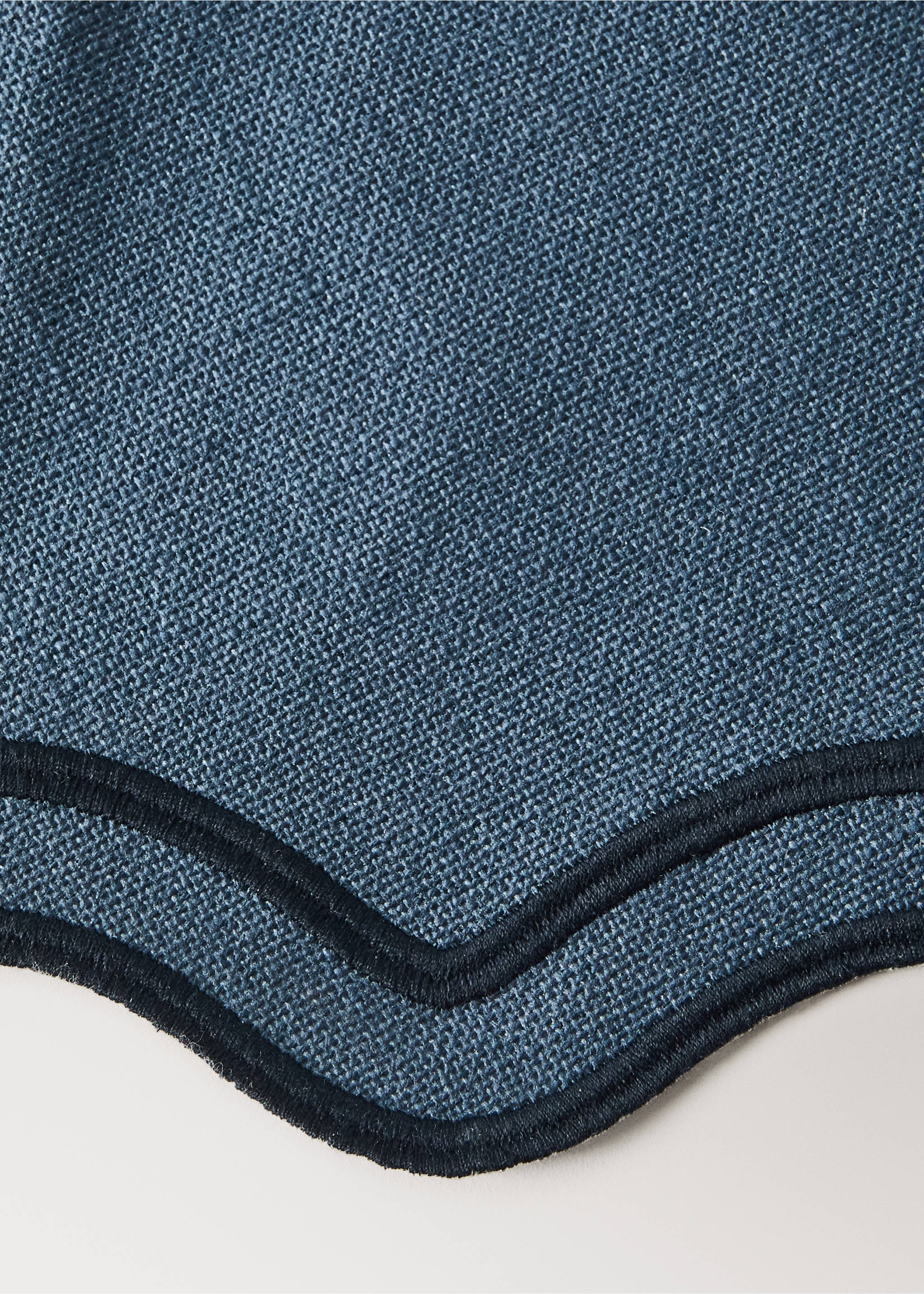 Blue woven placemat with a dark navy embroidered scalloped border., Blue. Ref: 37056332-00.