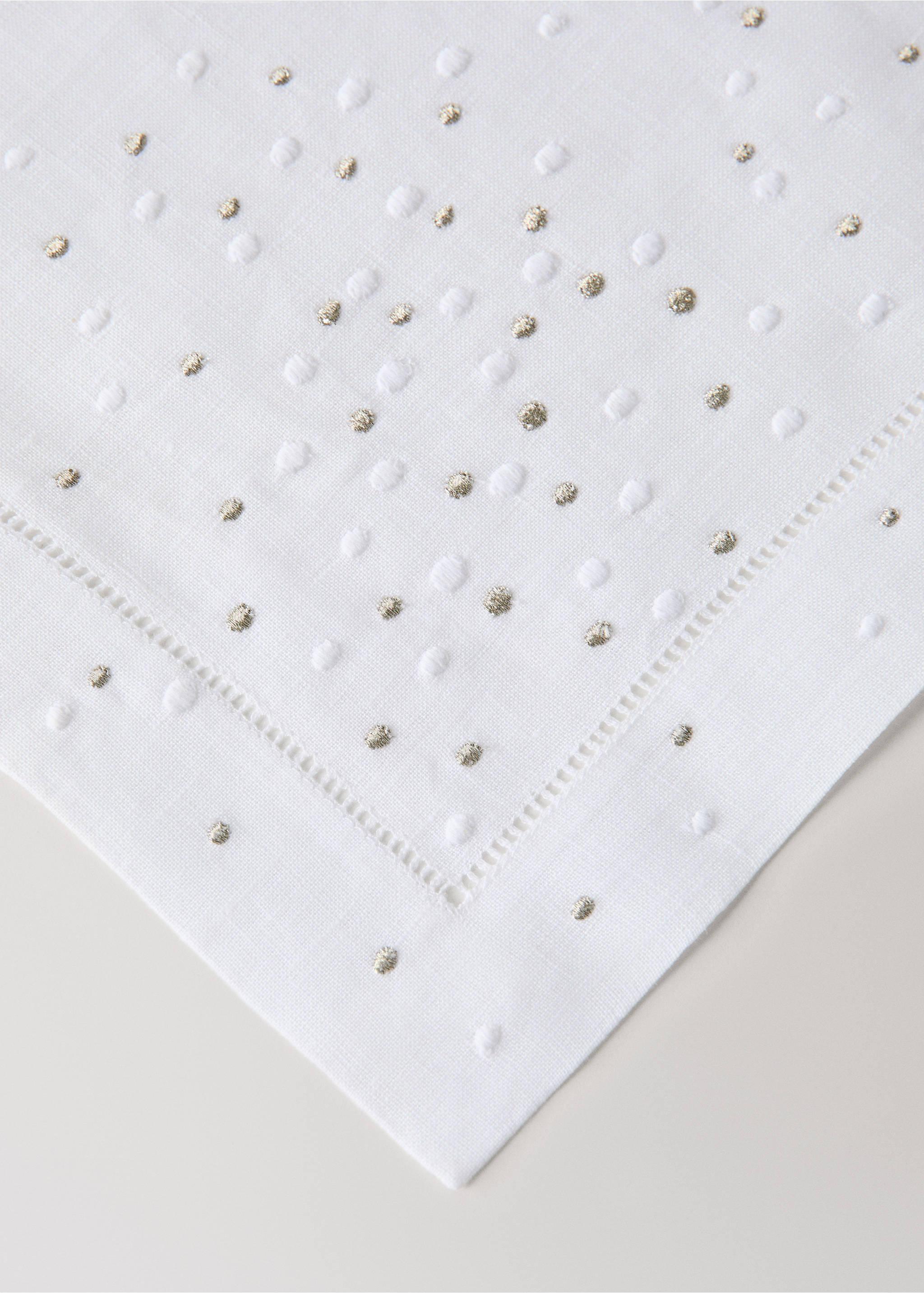 White placemat with raised white dots, gold flecks, and hemstitch., White. Ref: 37056333-00.