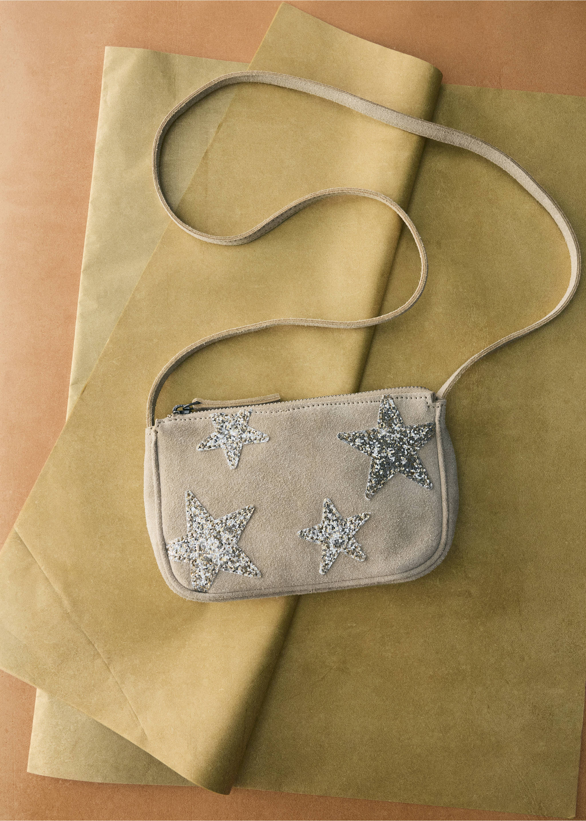 Beige suede mini crossbody bag with sparkly silver glitter star appliqués and a long shoulder strap., Navy. Ref: 37056361-00.