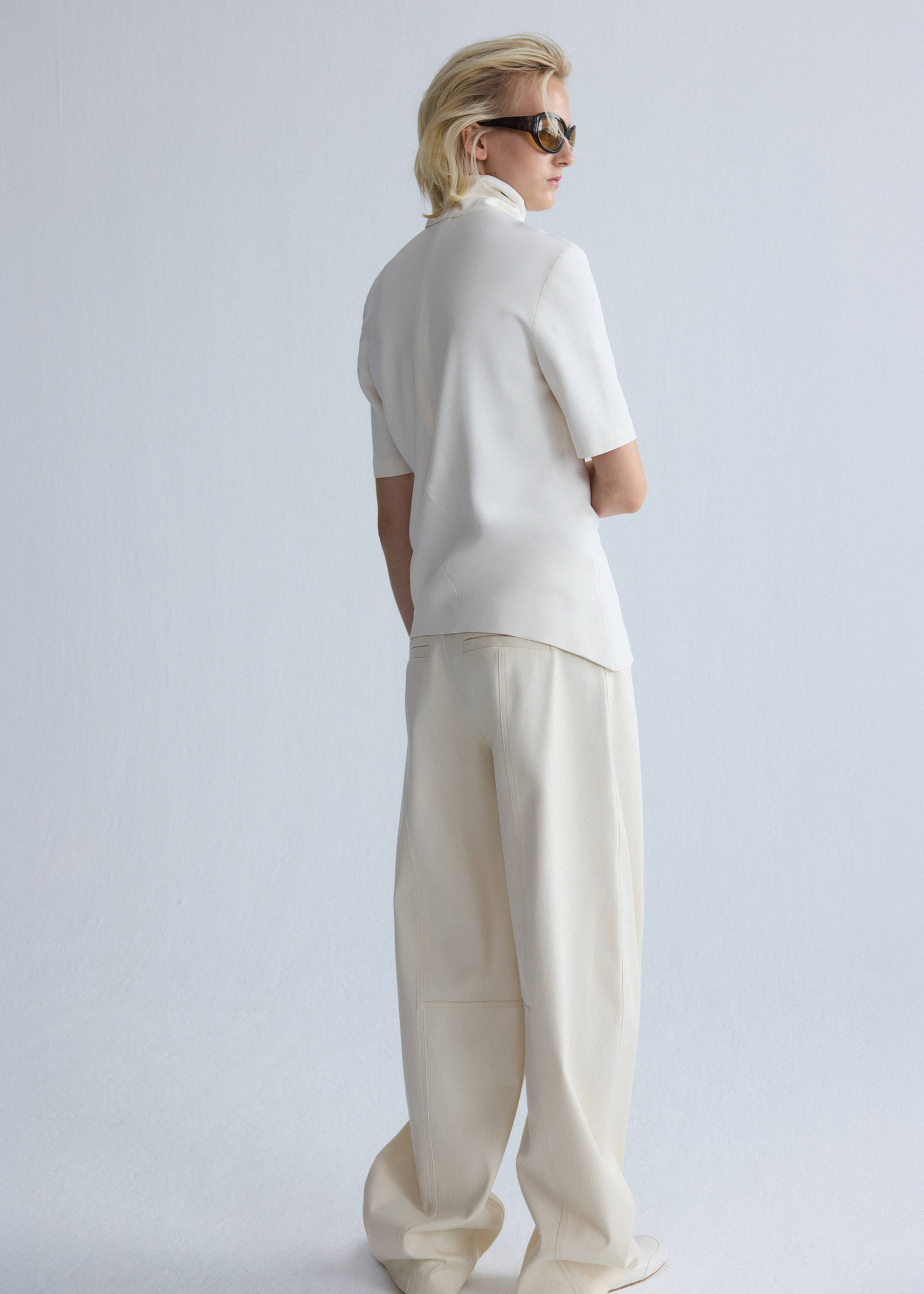 Asymmetrical high-neck blouse - Reverse of the article