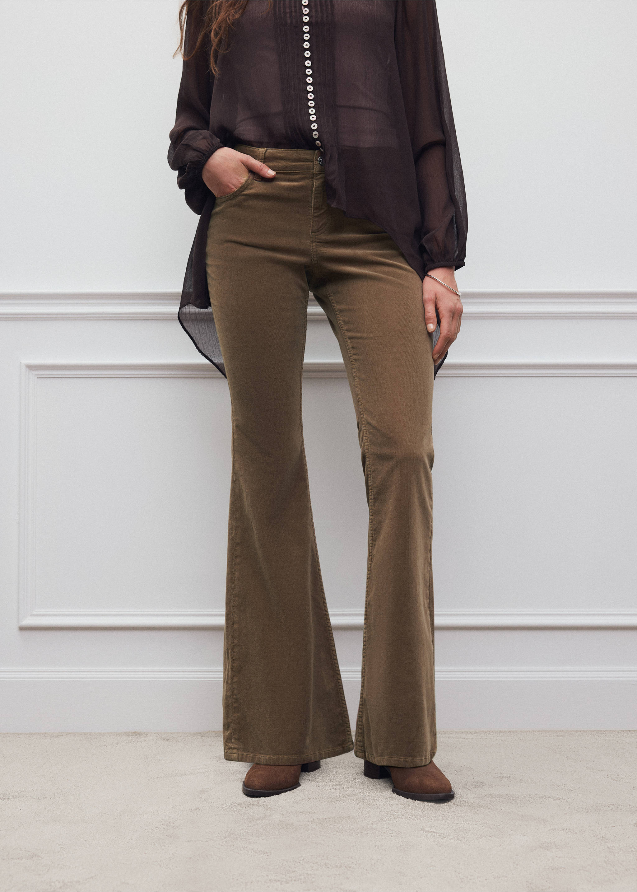 Dark olive green corduroy flared trousers worn with a dark sheer blouse., Medium Brown. Ref: 37056725-00.