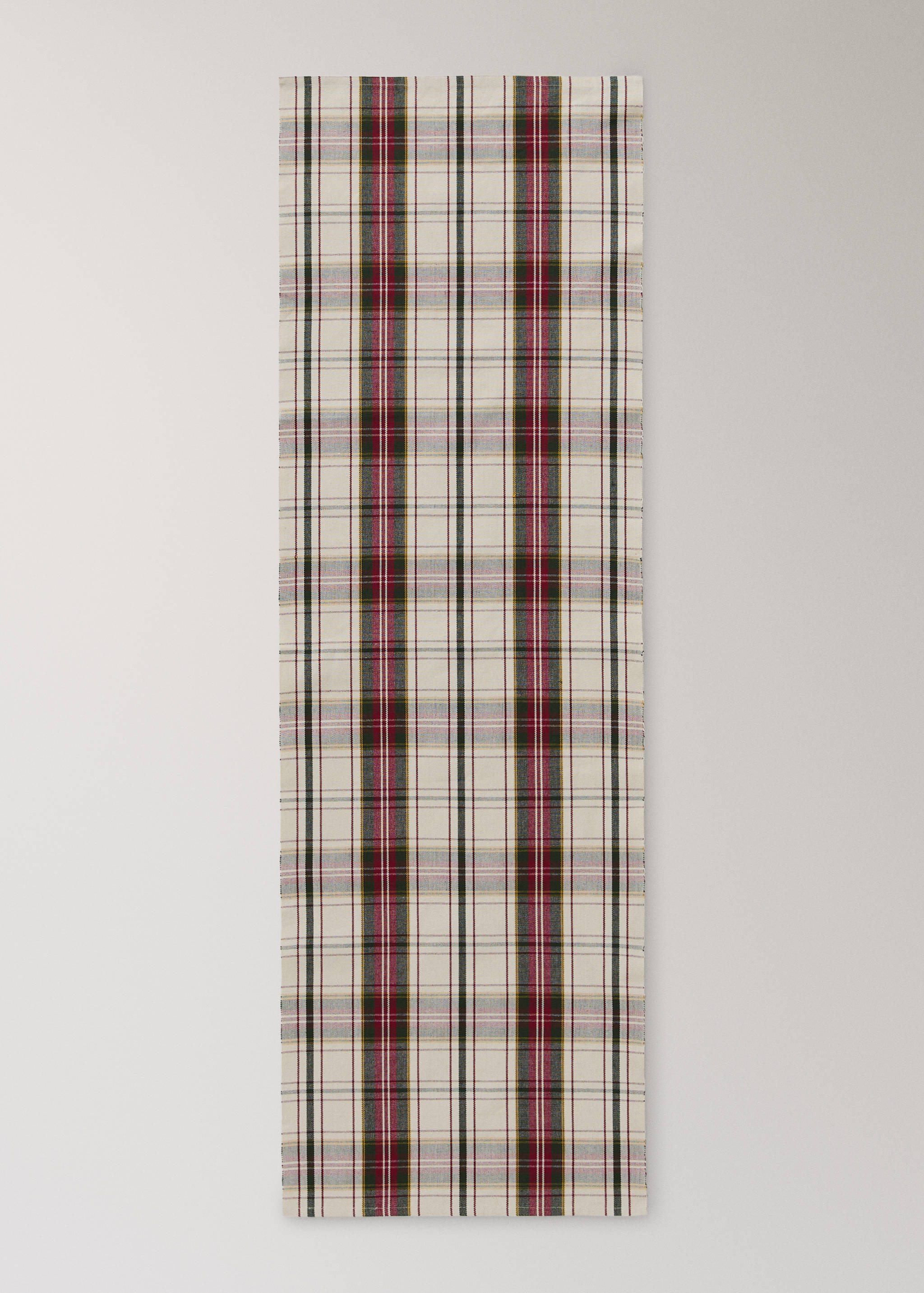 Plaid table runner in cream with dark green and burgundy stripes.