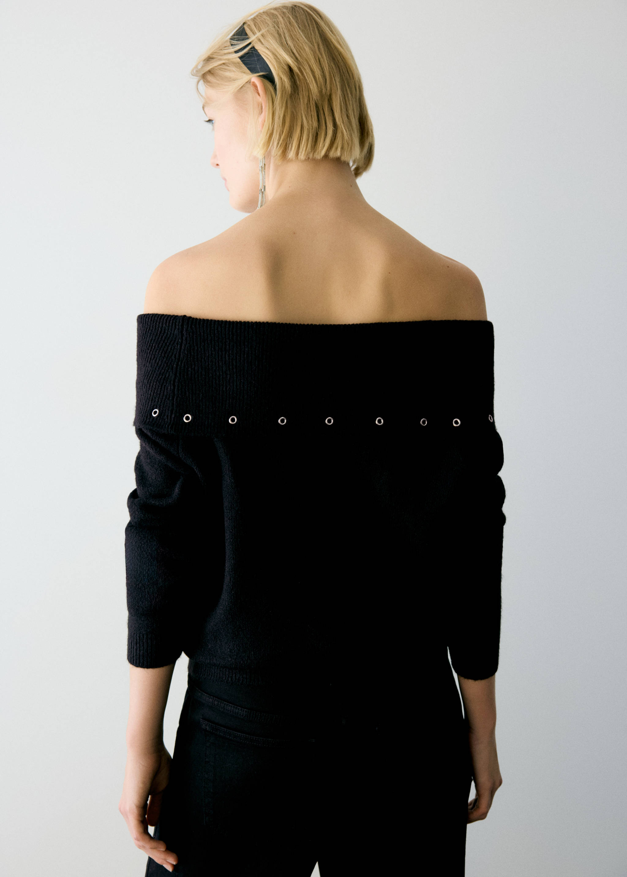 Asymmetrical eyelet jumper - Reverse of the article