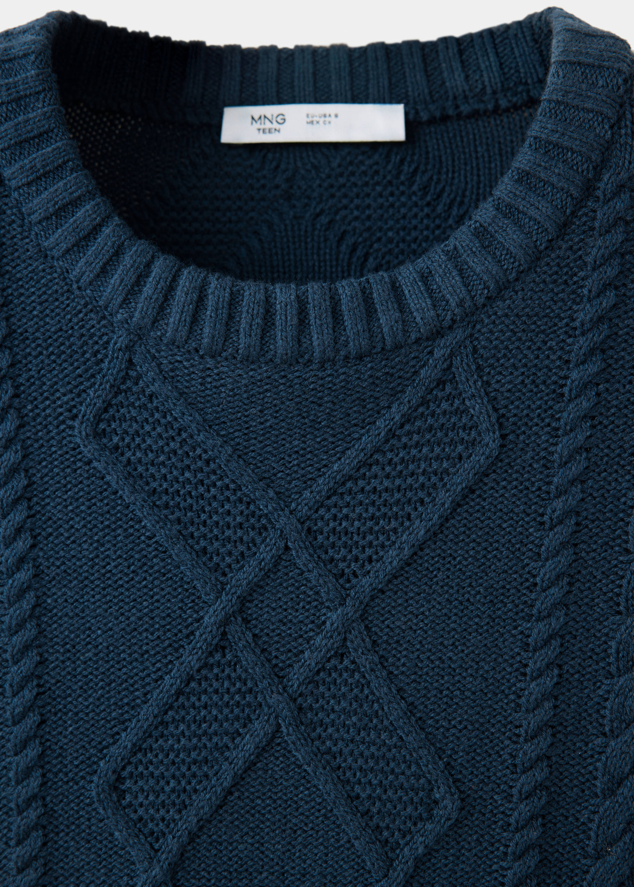 Dark blue teen knitted sweater with a ribbed round neckline and patterned cable-knit chest detail.