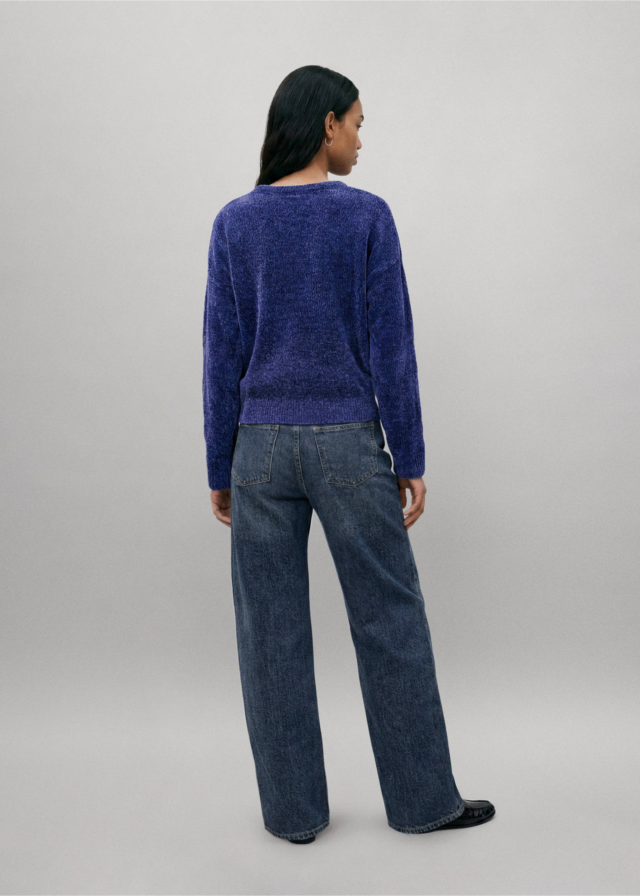 Blue textured jersey seen from the back, worn with dark denim trousers., Indigo Blue. Ref: 37057133-00.
