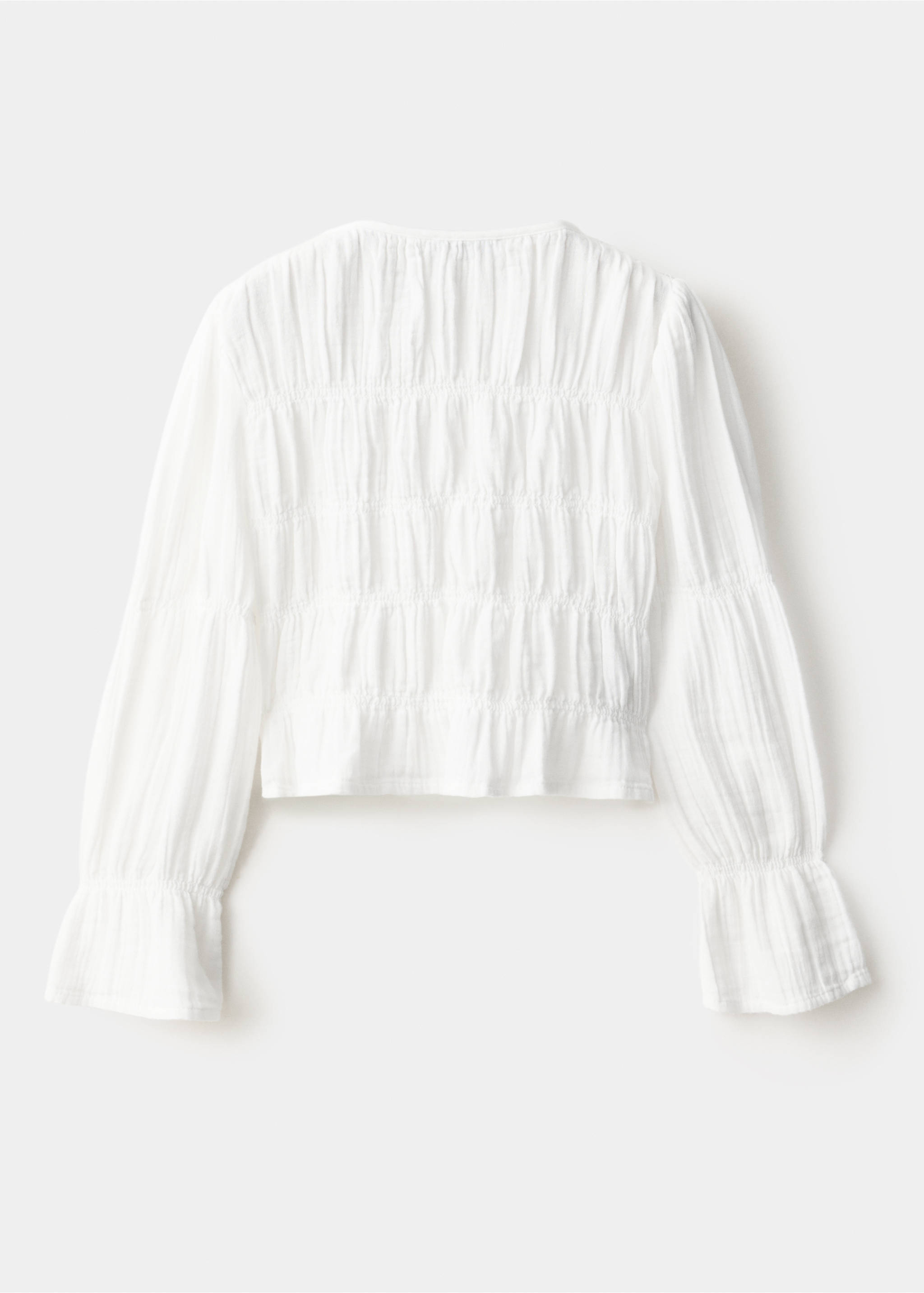 White shirt with smocked back and long sleeves, back view., White. Ref: 37057136-00.